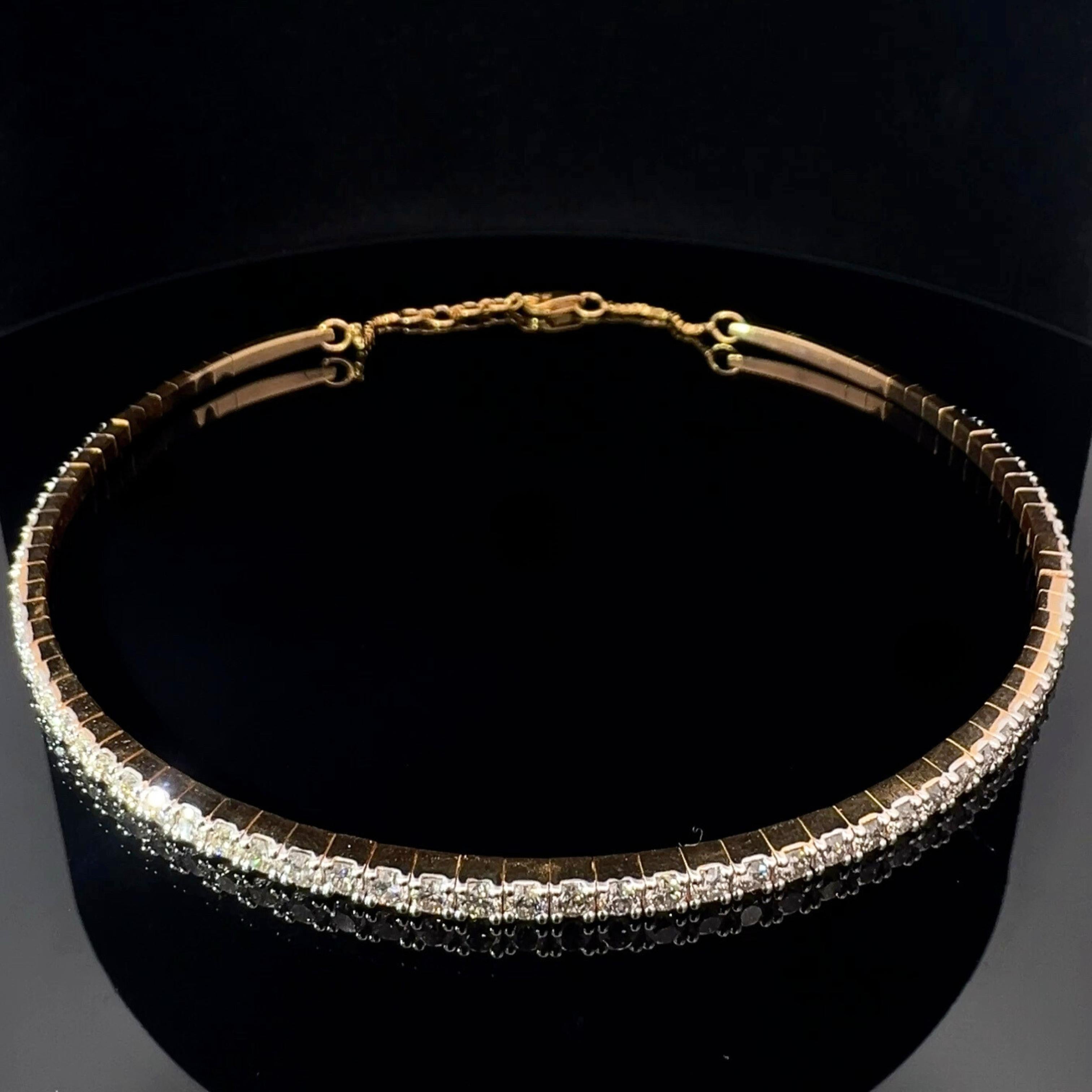 Make a bold statement with the Mode Large Diamond Choker, featuring 5.73 carats of dazzling natural diamonds. Crafted in 14k yellow, white, or rose gold, this luxurious piece exudes modern elegance and undeniable allure.

Bracelet