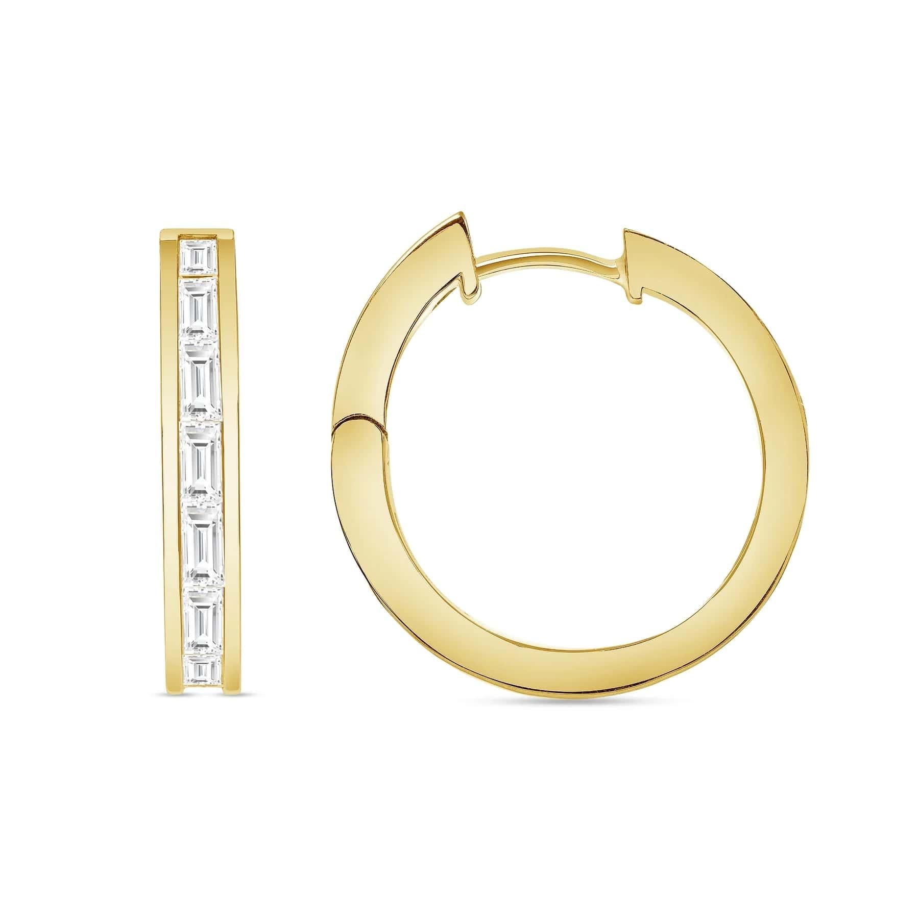 Elevate your elegance with the exquisite allure of our Diamond Baguette Hoop Earrings. Each earring showcases stunning baguette-cut diamonds gracefully set within a classic 18k gold frame, creating a harmonious blend of sophistication and