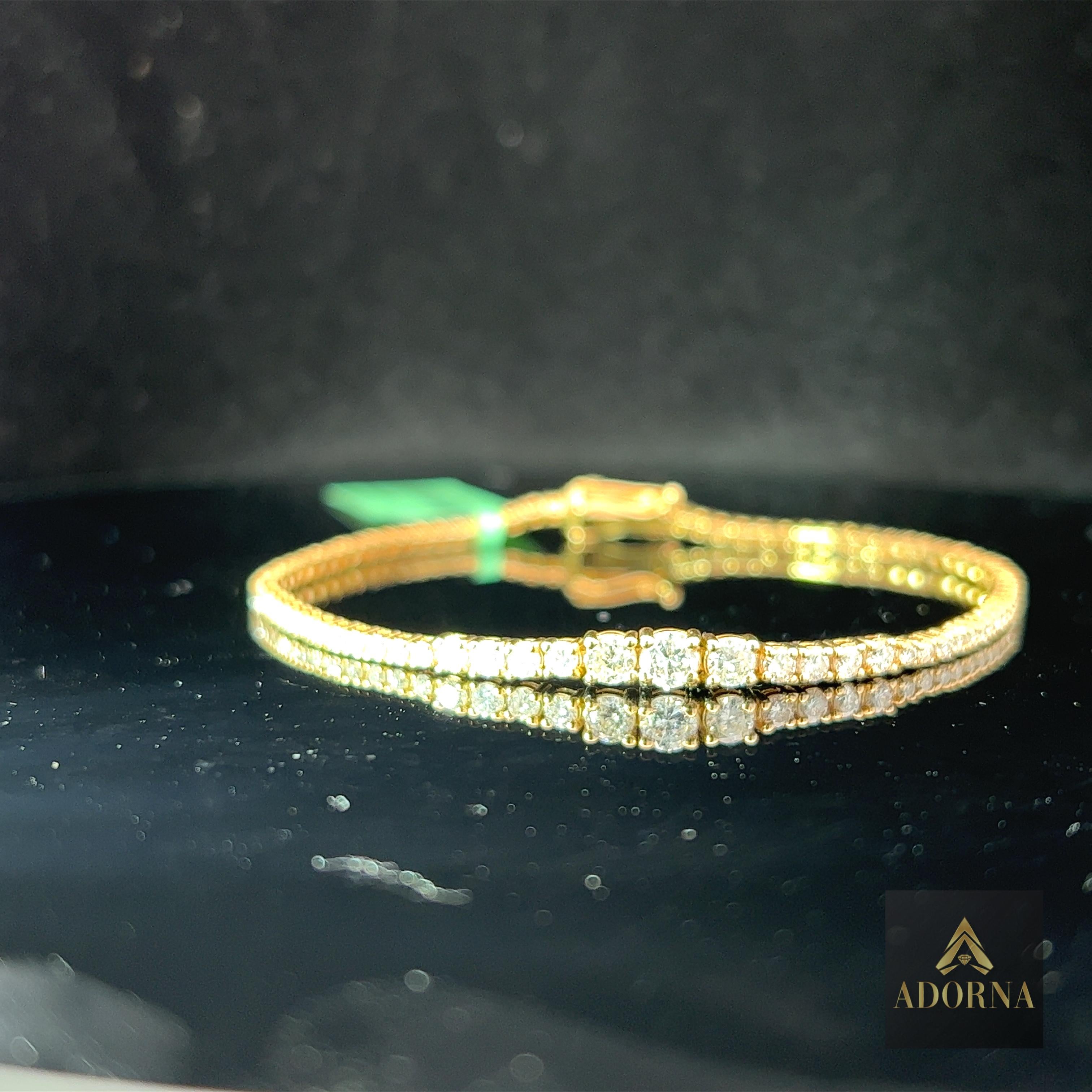 Allow us to introduce the exquisite Gold and Diamond Bracelet, a true embodiment of elegance and opulence. This masterpiece of jewelry is handcrafted to perfection, seamlessly marrying the timeless allure of gold with the brilliance of diamonds.

At