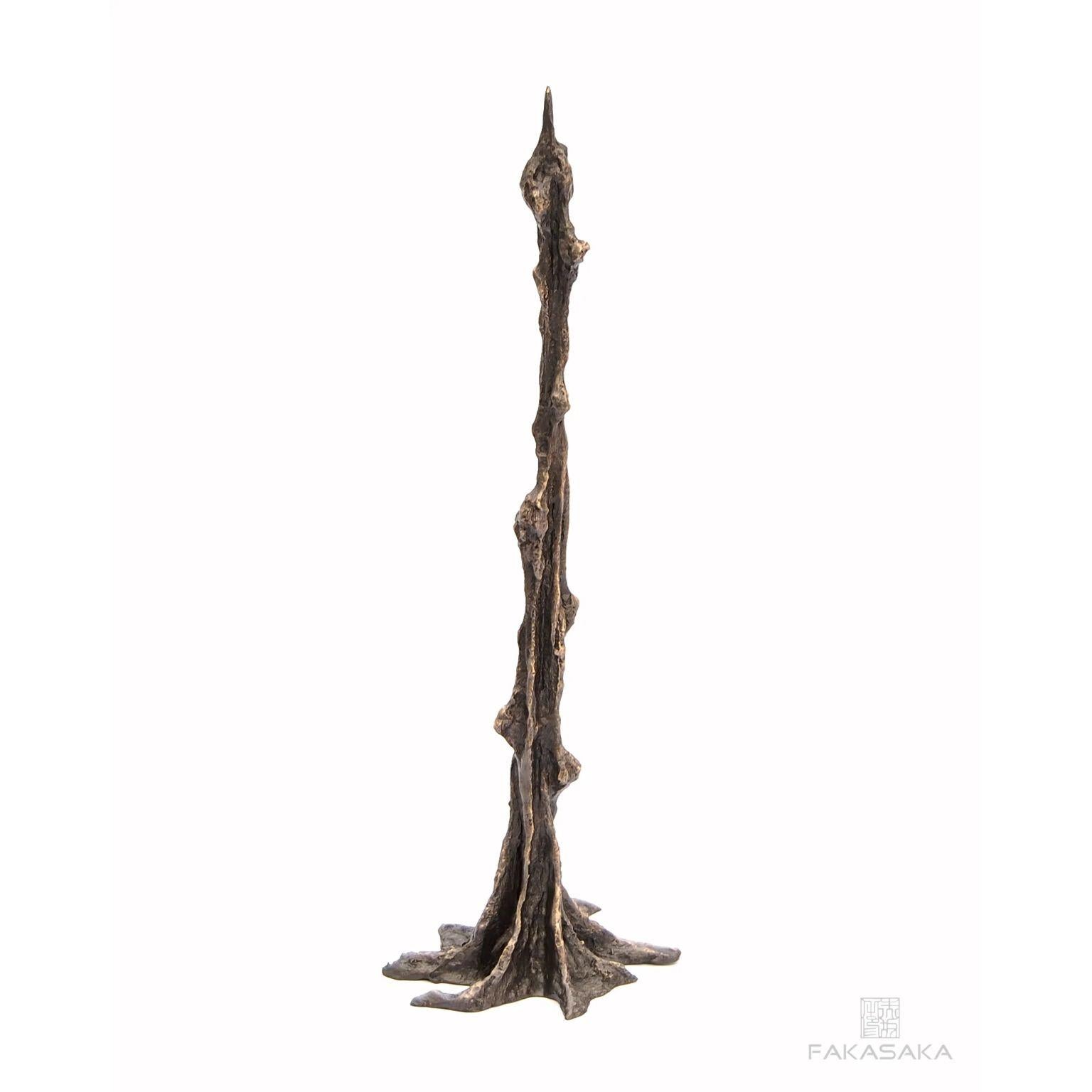 Adri candleholder by Fakasaka Design.
Dimensions: W 12.5 cm, D 10 cm, H 36.5 cm.
Materials: dark bronze.
Also available in polished bronze.

 FAKASAKA is a design company focused on production of high-end furniture, lighting, decorative objects,