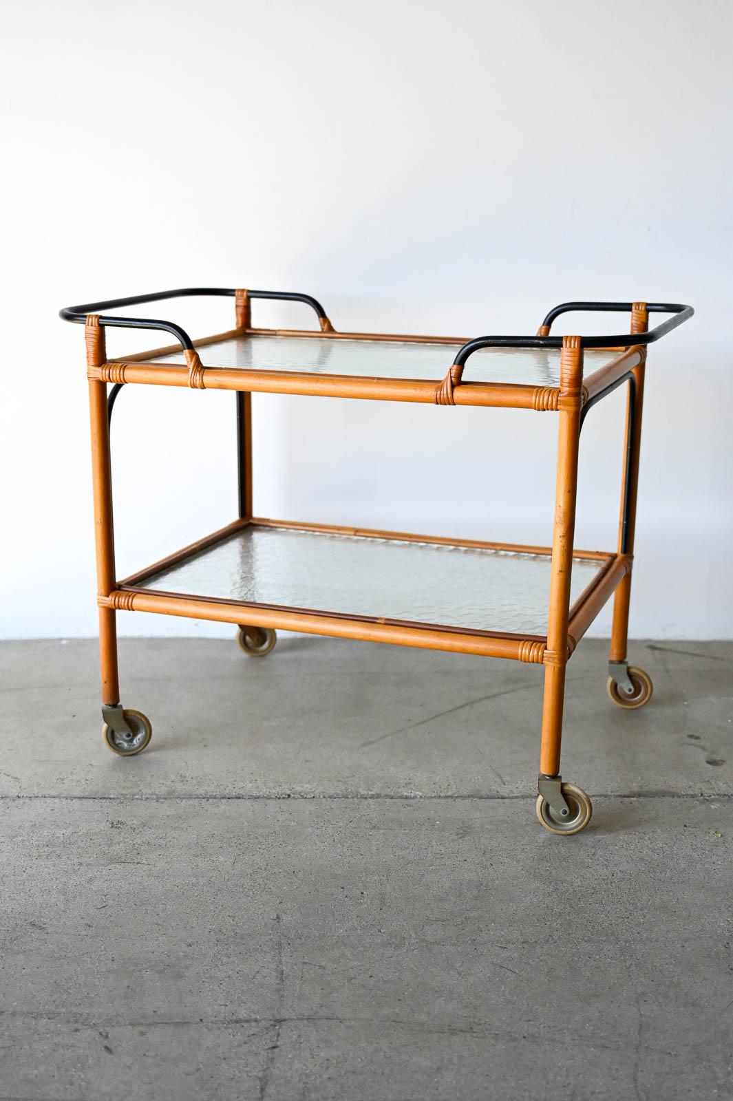 Adrian Audoux and Frida Minet Bamboo Iron and Glass Bar Trolley, ca. 1950.  Great rolling bar cart or trolley by French designers Audoux and Minet.  Split bamboo frame with original textured glass and iron handles.  Wonderful simple design with