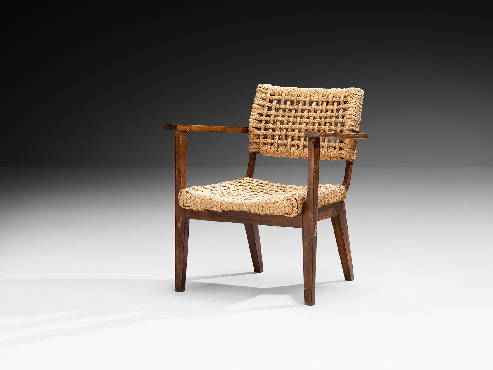 Adrien Audoux and Frida Minet per Vibo, poltrona, faggio tinto, paglia, Francia, anni '50

Poltrona rustica progettata dal duo Adrien Audoux e Frida Minet. La seduta e lo schienale sono realizzati in canapa intrecciata, ricavata dalla pianta