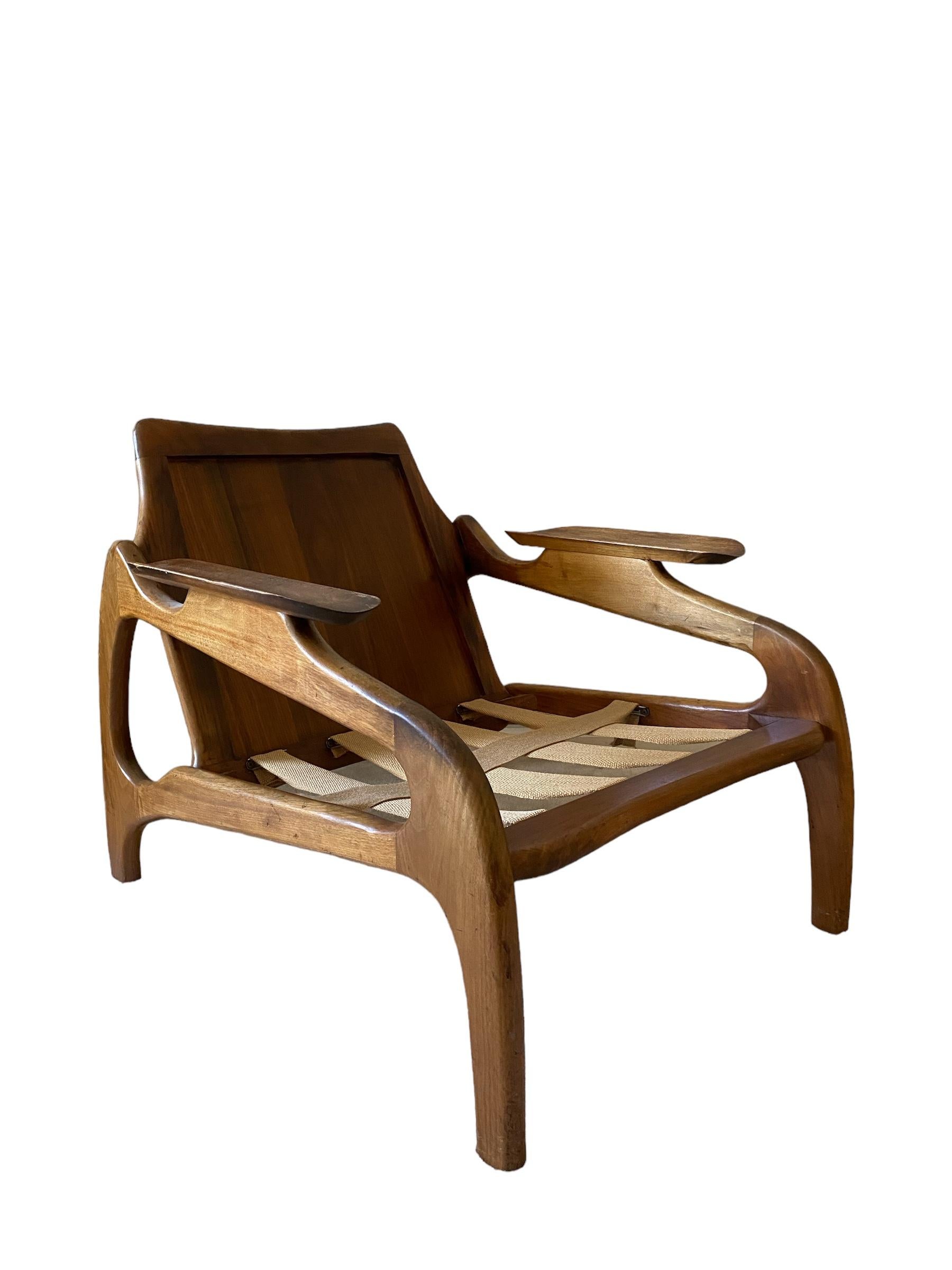 Model 1209-C for Craft Associates.   A beautiful sleeping walnut chair, with the most beautiful low proportions. Extremely comfortable, and beautiful from every angle. 

Walnut frame, solid back panels in walnut, upholstery. Cushions have new foam