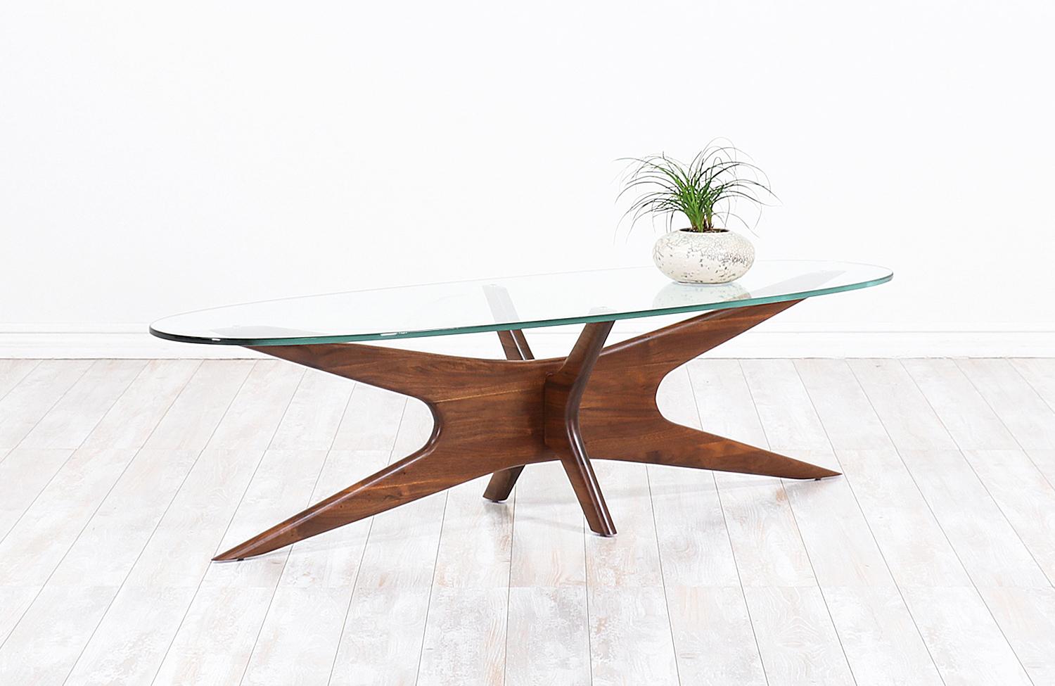 Mid-Century Modern coffee table Model 893-TGO designed by Adrian Pearsall for Craft Associates in the United States, circa 1960s. Like many of Pearsall’s designs, this exceptionally crafted coffee table incorporates the fun and sophisticated shapes