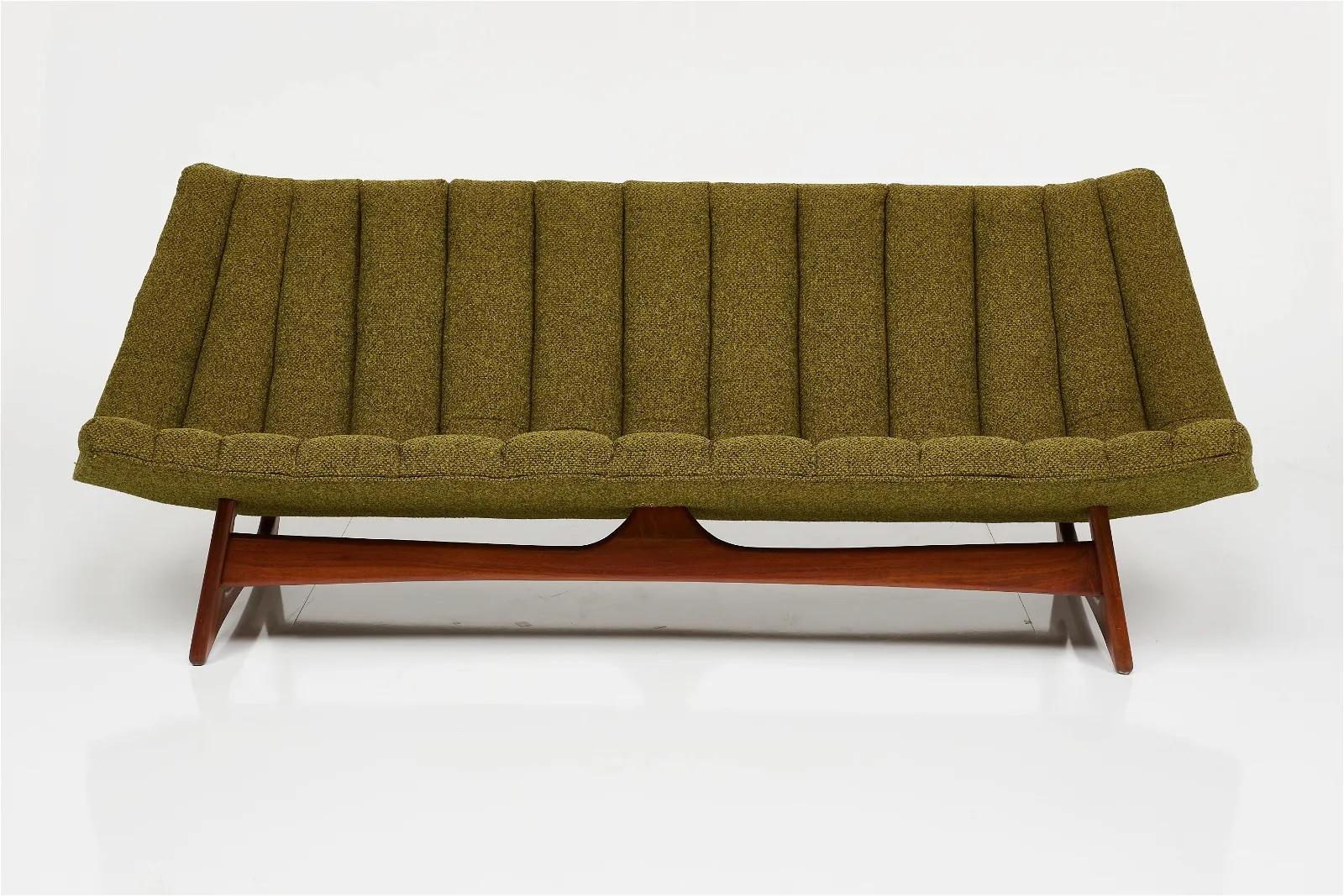 This well taken care of armless sofa by American furniture designer, Adrian Pearsall will surely make your space that much more unique! 

This armless sofa was constructed by the Craft Associates in Pennsylvania and is made from fabric and walnut.