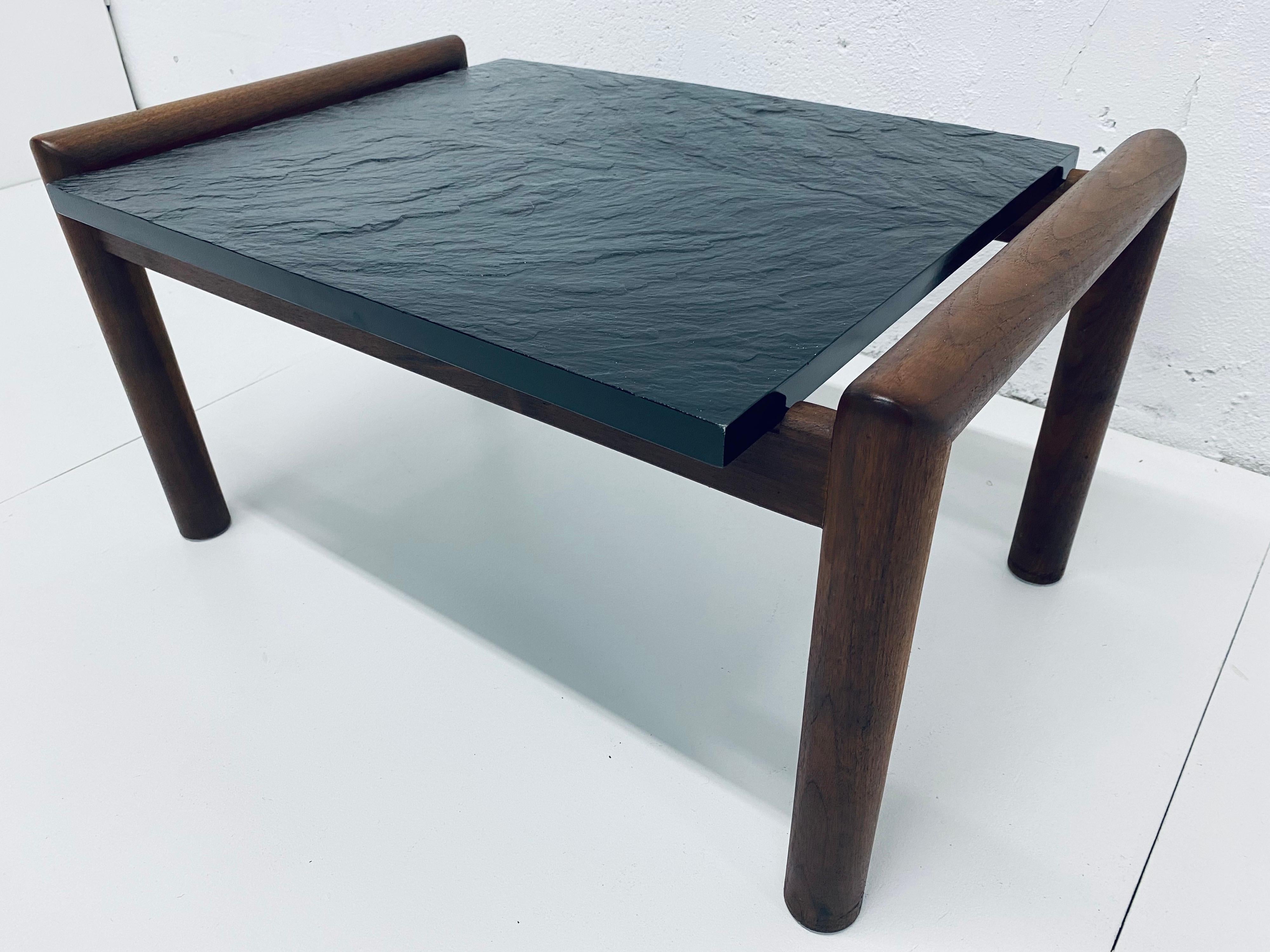 Midcentury black slate top on a walnut base side table designed by Adrian Pearsall for Craft Associates.