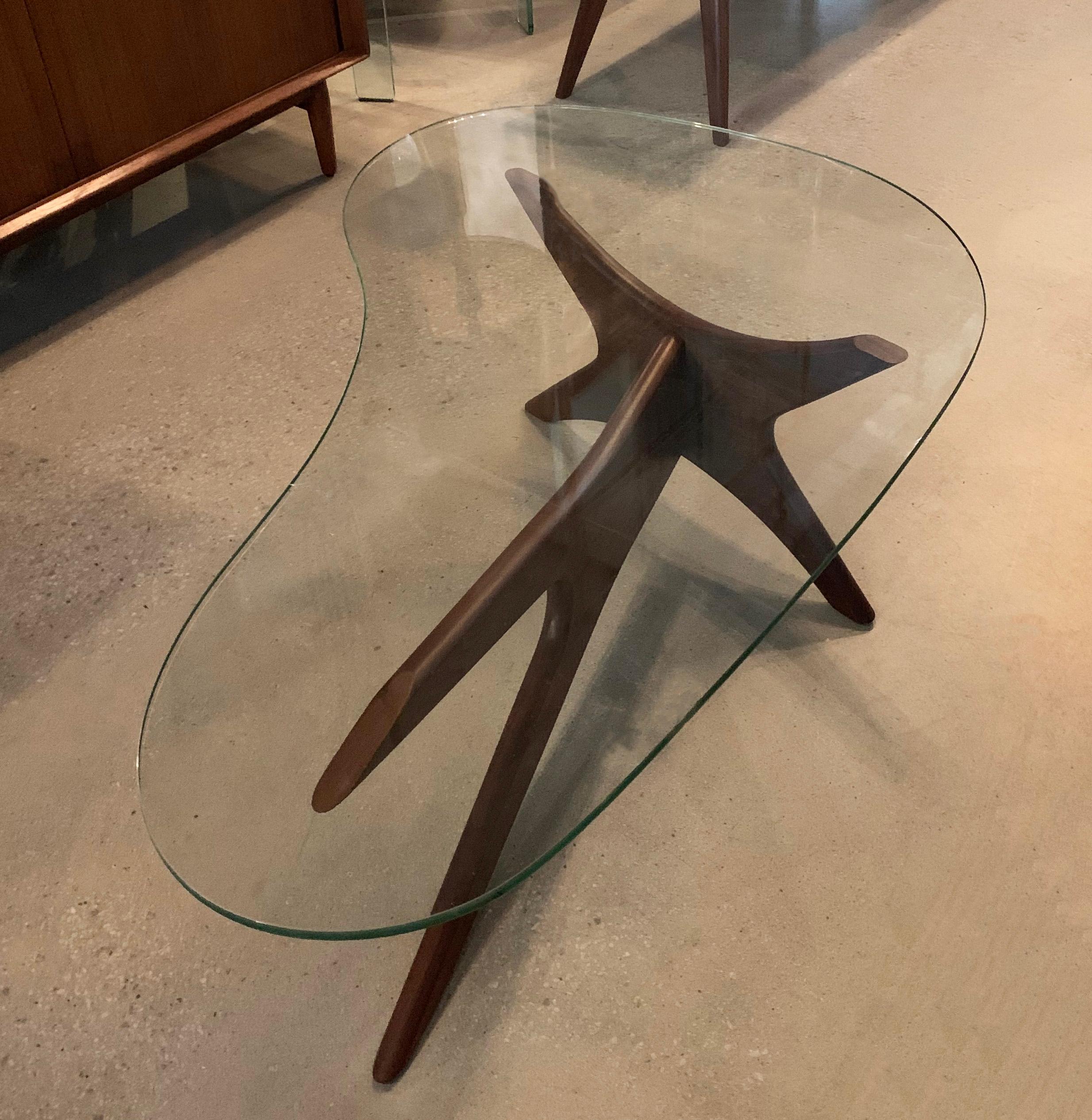 Mid-Century Modern coffee table by Adrian Pearsall for Craft Associates features a walnut boomerang base with biomorphic glass top.