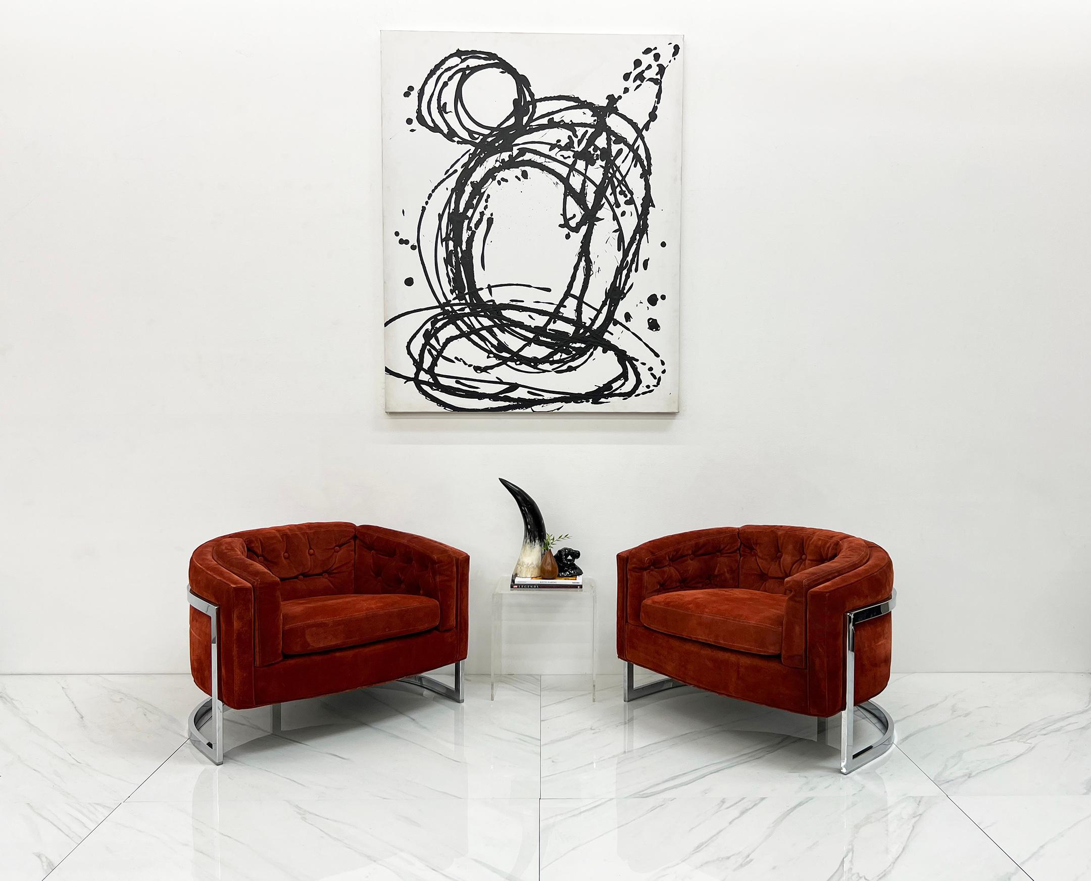 Designed by Adrian Pearsall for Craft, these chairs are gorgeous. With large barrel back chrome T back frames, and ultra luxurious red suede leather upholstery, these chairs are the embodiment of the glam 1970's style.

These ultra comfortable