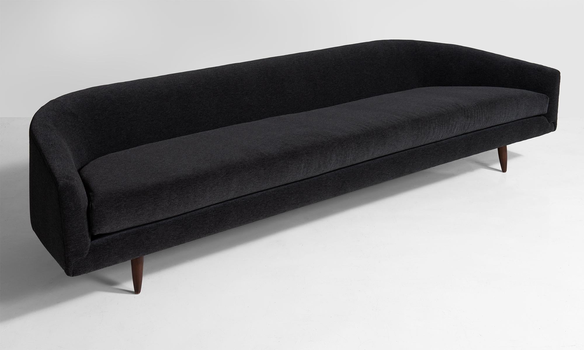 Adrian Pearsall cloud sofa, America, circa 1960.

Designed by Adrian Pearsall, manufactured by Craft Associates. Elegant design, reupholstered in Maharam Mohair Supreme, on walnut legs.