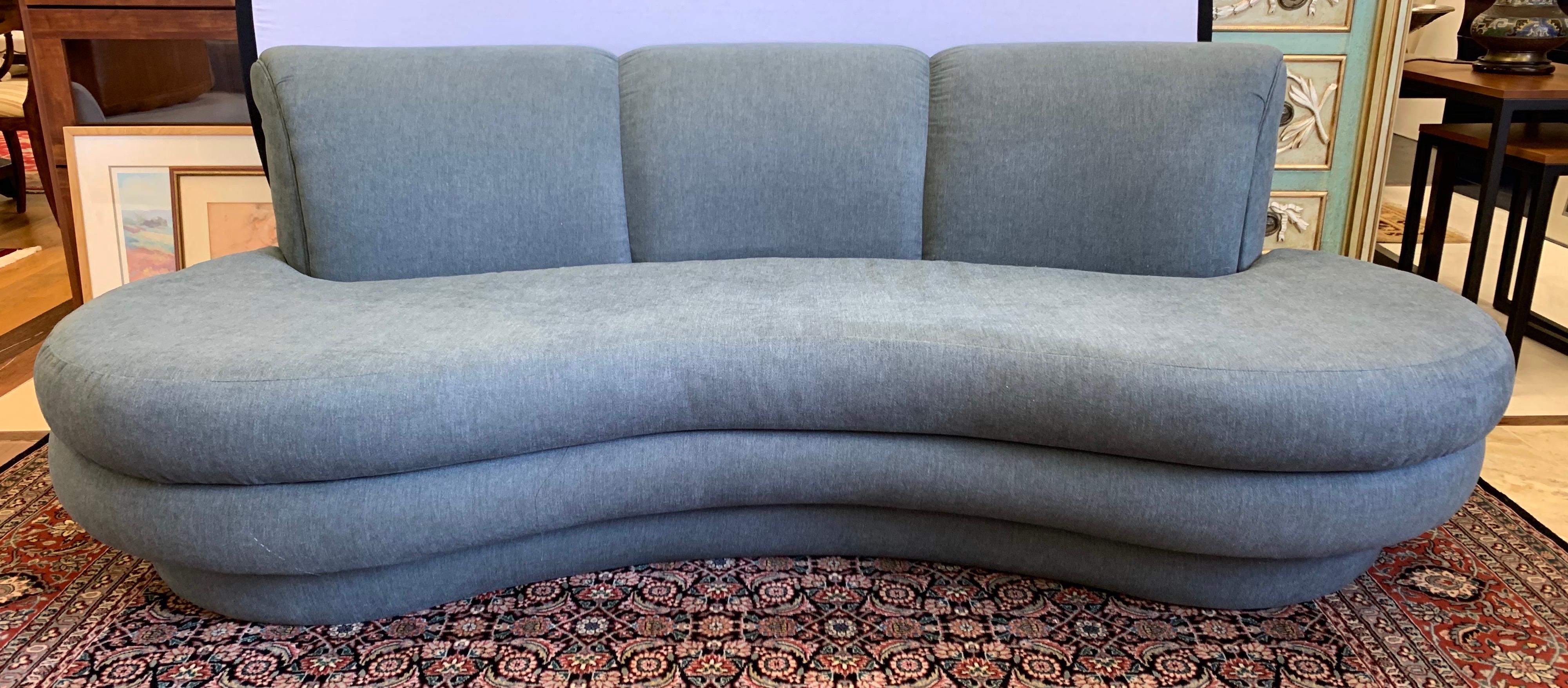 Newly upholstered in a luxurious slate gray cotton blend fabric, this Pearsall seven-foot sofa has the curved silhouette, scale and comfort that make it so coveted.

 