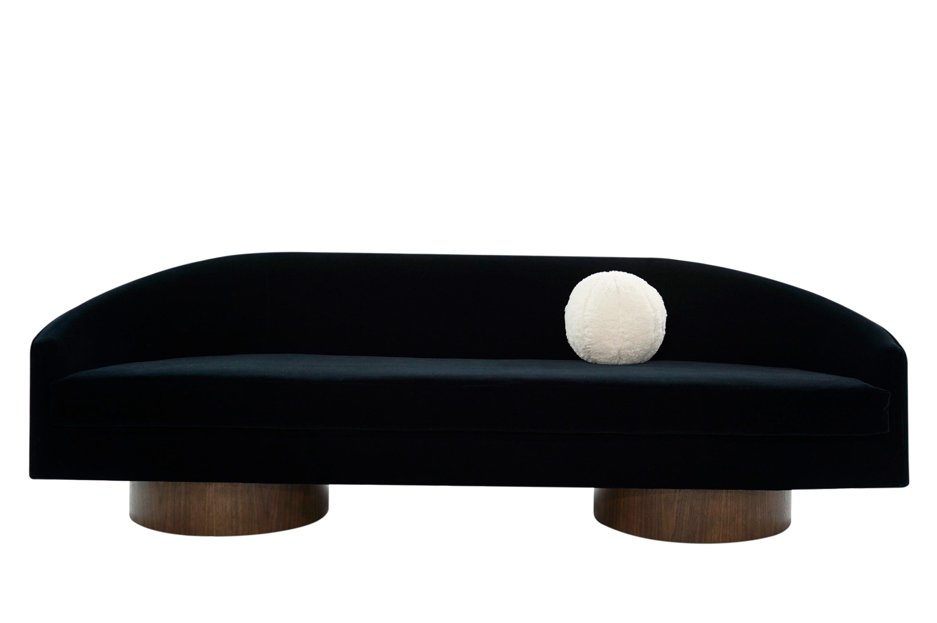 Rarely seen cloud sofa designed by Adrian Pearsall for Craft Associates on walnut pedestal bases. Newly upholstered in navy blue velvet mohair.