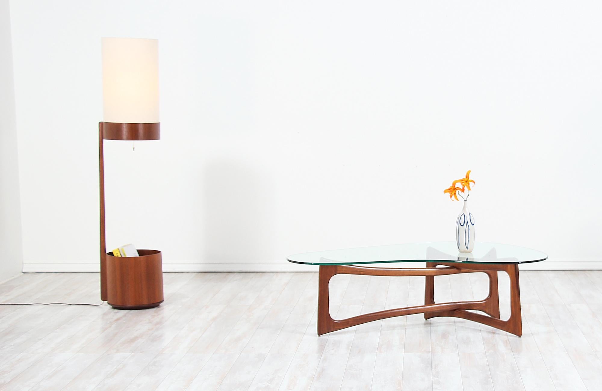 Elegant Mid-Century Modern 2450-TK coffee table designed by Adrian Pearsall for Craft Associates in the United States, circa 1960s. This coffee table features a new custom made kidney-shaped glass and a sculptural walnut wood base with a vibrant