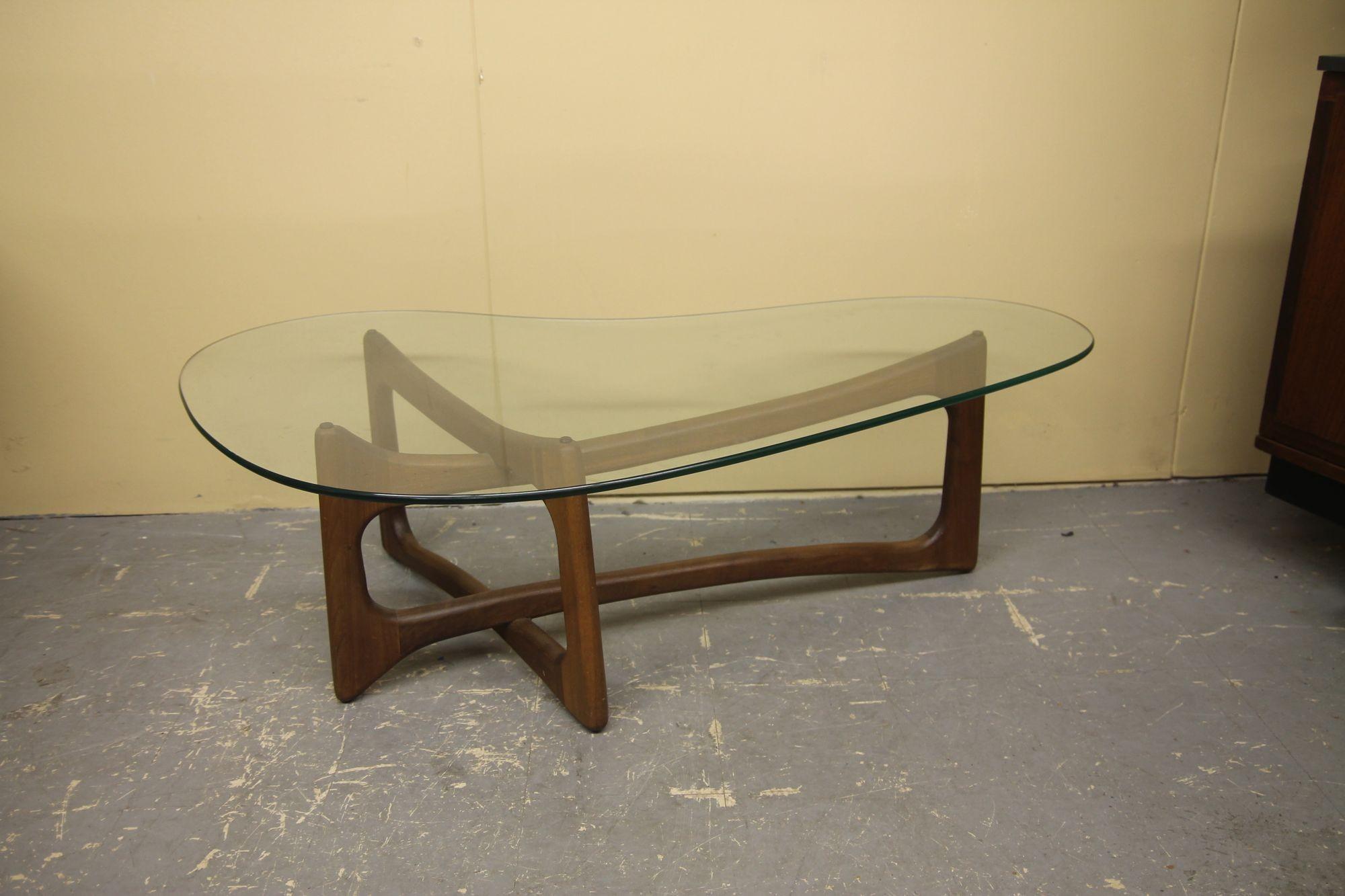 Nice Pearsall walnut coffee table with kidney shaped glass. This is one of the rarer designs. I will also be posted a pair of side tables that were meant to go with this great table.