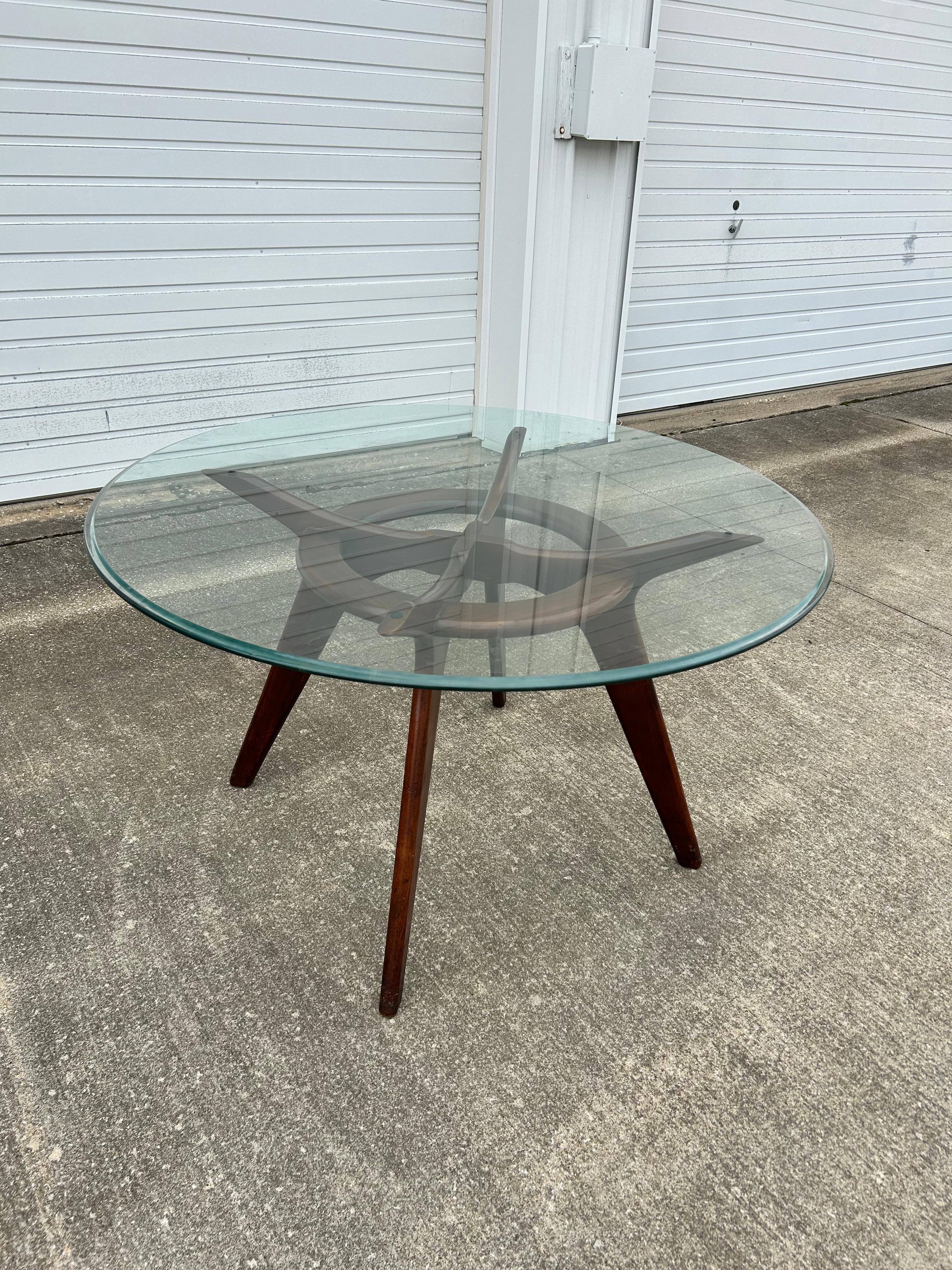 Own a piece of design history with the iconic Compass Dining Table designed by Adrian Pearsall for Craft Associates in 1952.  This table features a stunning walnut base and a sleek and minimalist design that embodies the definition of mid-century