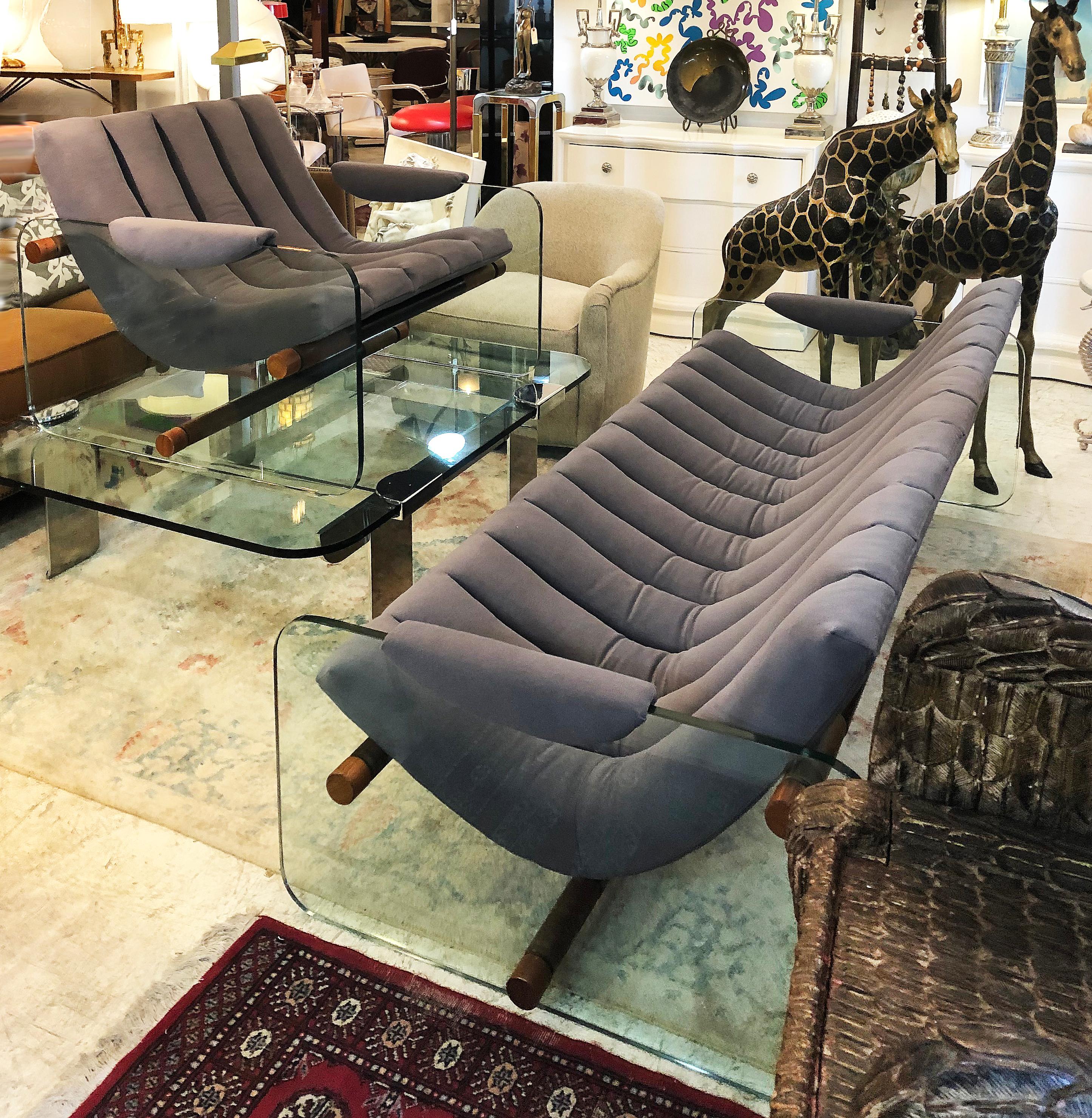 Adrian Pearsall Craft Associates glass sided club chairs

Offered for sale is a pair of Adrian Pearsall for Associates newly upholstered glass side club chairs. The glass sides and upholstered seats are supported by wooden dowels which extend from