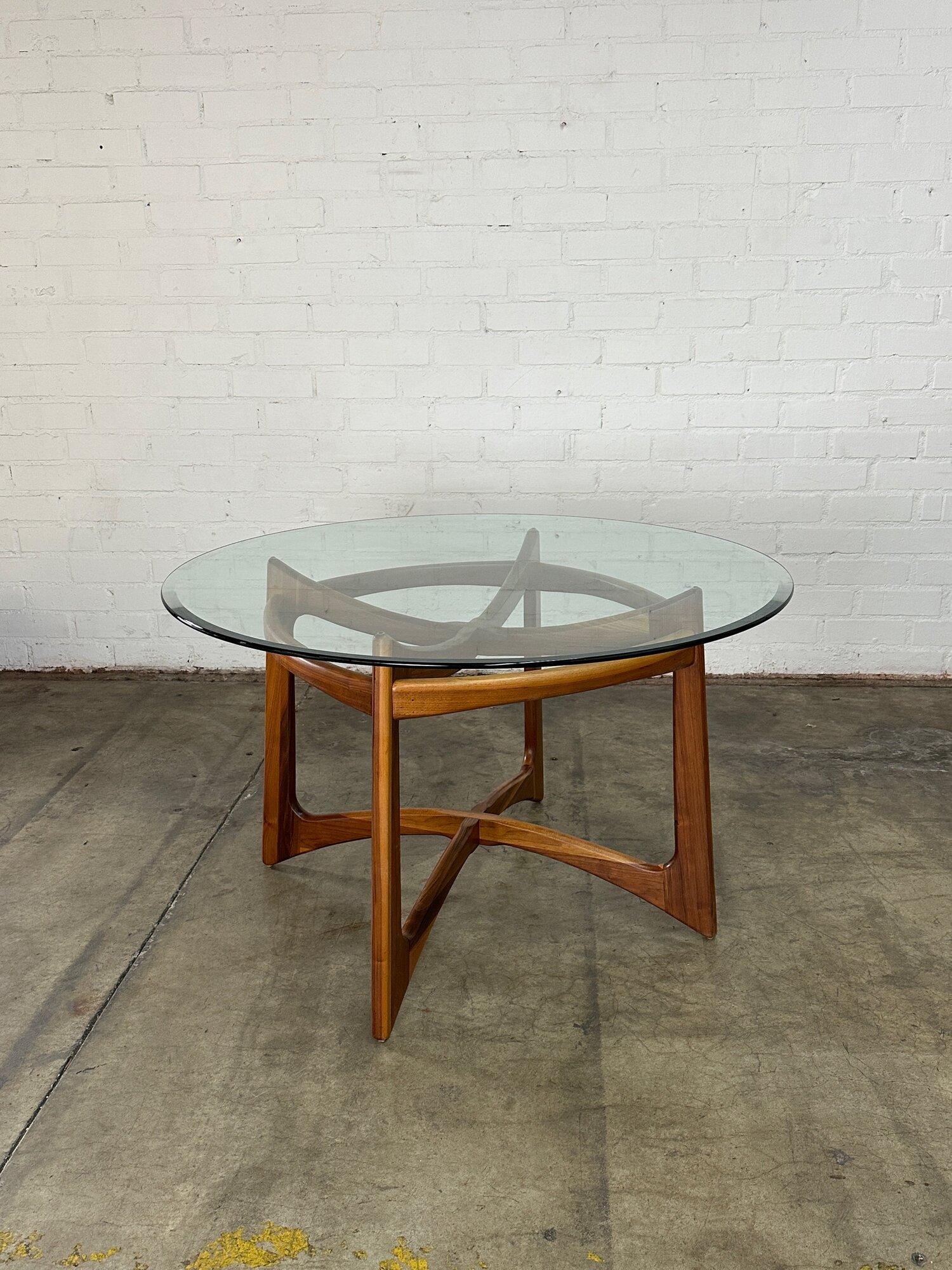 W48 H29.25 KC28 BASE WIDTH 29

Fully restored Adrian Pearsall dining table in solid walnut with a glass surface. Item is structurally sound and sturdy. Surface glass shows well no visible chips or cracks. One visible scratch on surface has been