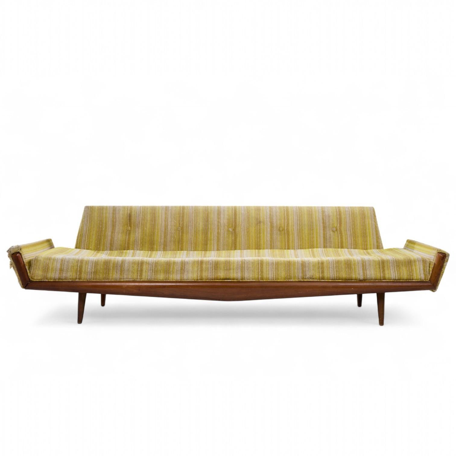 Adrian Pearsall for Craft Associates 2000-S Mid Century Walnut Gondola Sofa

This sofa measures: 112 wide x 32 deep x 29.5 inches high, with a seat height of 17.5 and arm height of 20 inches

Fair Vintage Condition - Sofa Frame has Scratches and