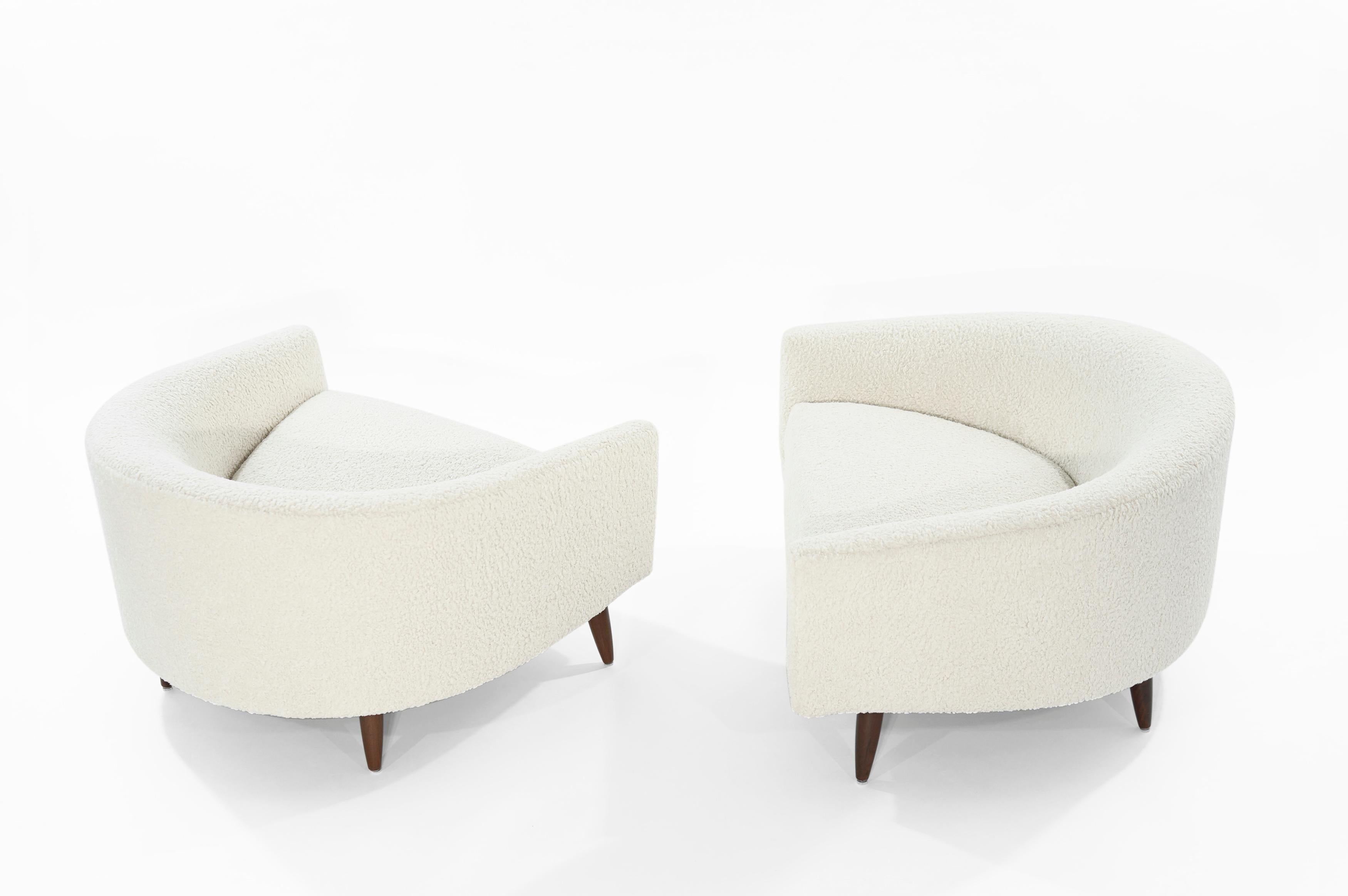 Rare pair of low and wide profile, lounge chairs designed by Adrian Pearsall for Craft Associates. Extremely comfortable! Perhaps one of Adrian's best designs.

Newly upholstered in off-white bouclé by Kravet. Walnut legs fully restored.
   