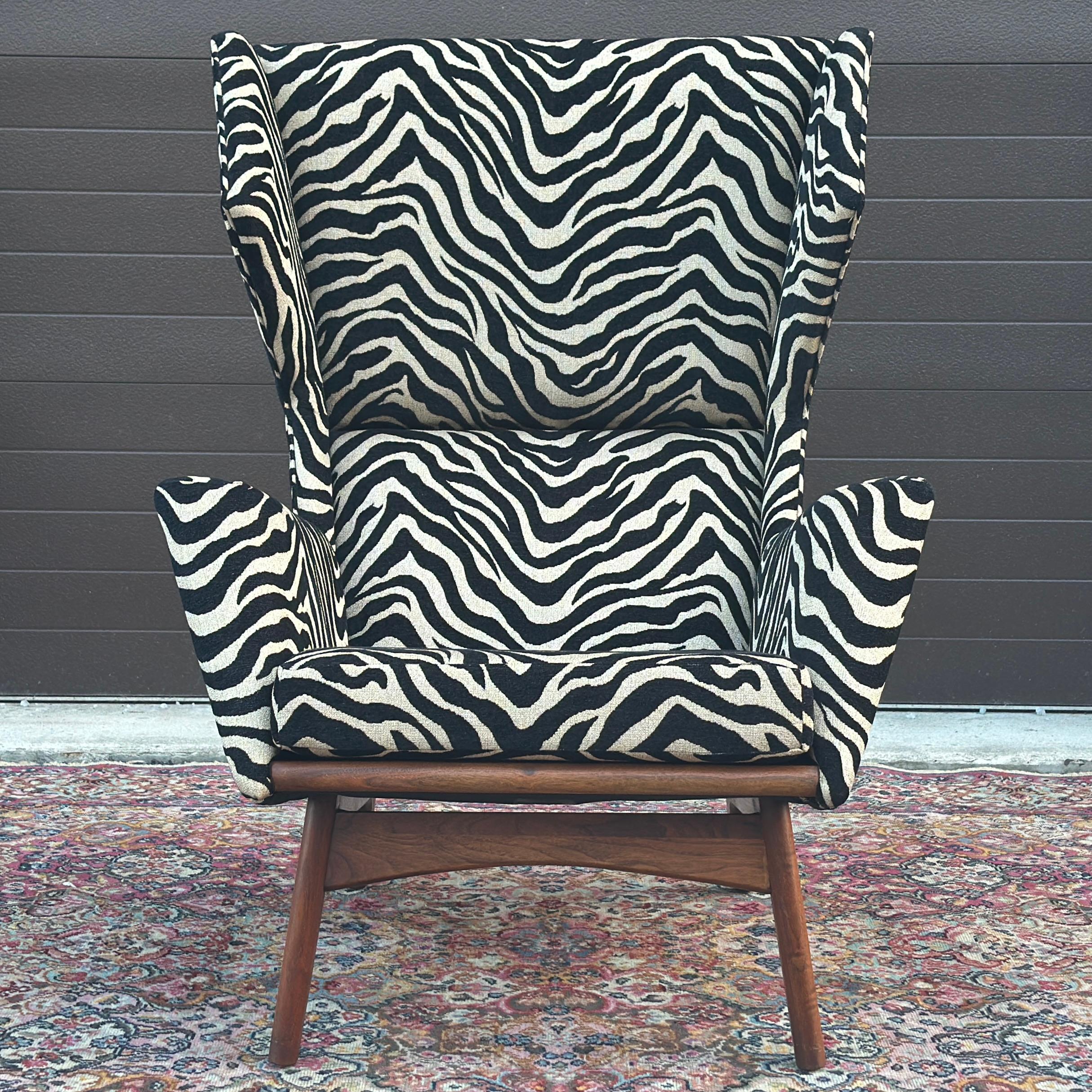 Sculptural Wing Chair by Adrian Pearsall for Craft Associates Inc. Model 2206. Reupholstered recently in a black and beige woven zebra print. The fabric is not black and white - it is black and beige. We found that the unfinished top of the walnut