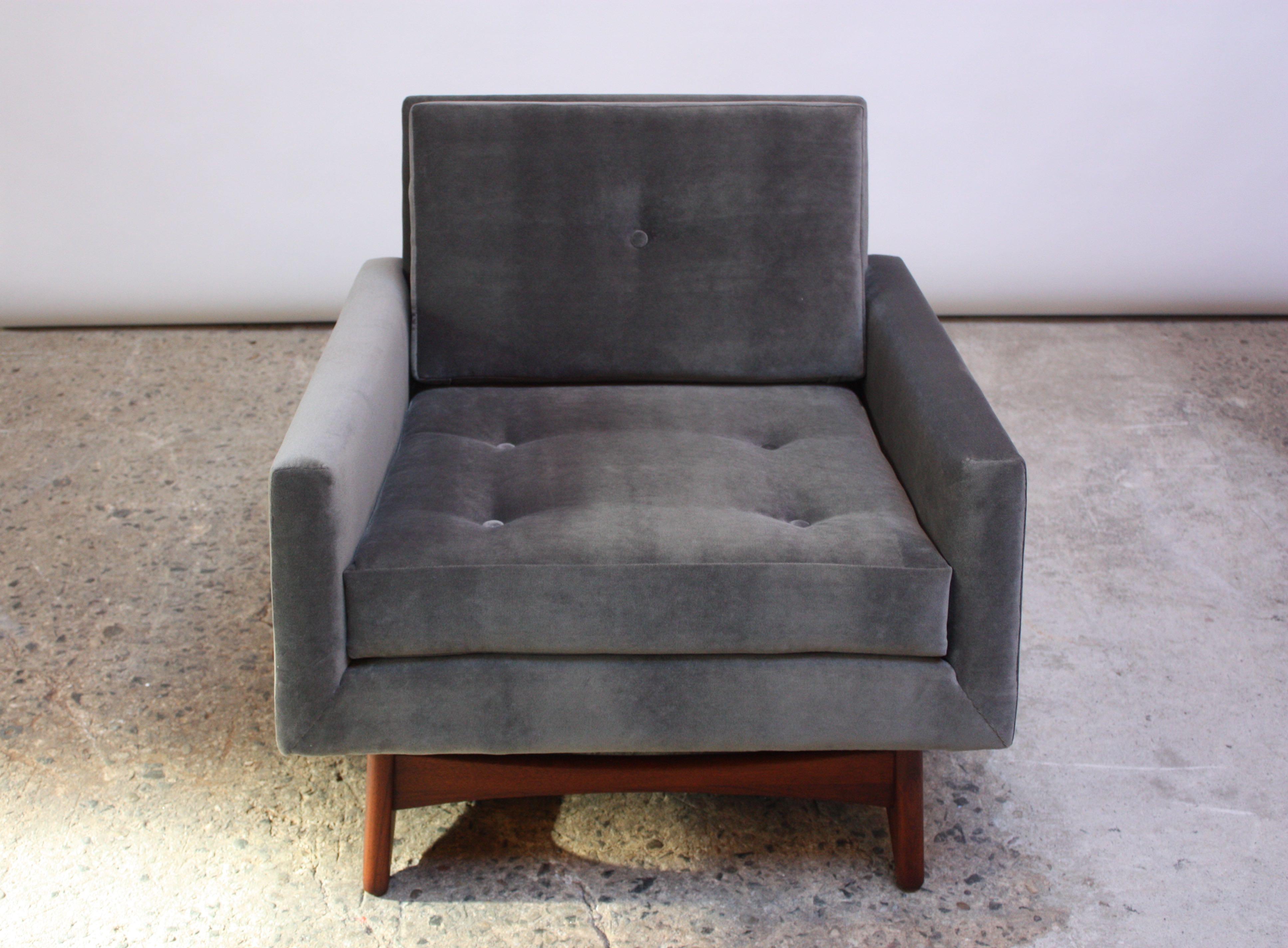 Model #2406-C club or lounge chair designed by Adrian Pearsall for Craft Associates in the 1960s. Composed of a sculpted walnut base which supports the frame. The back cushion features a single button, and the seat is fully tufted and buttoned.