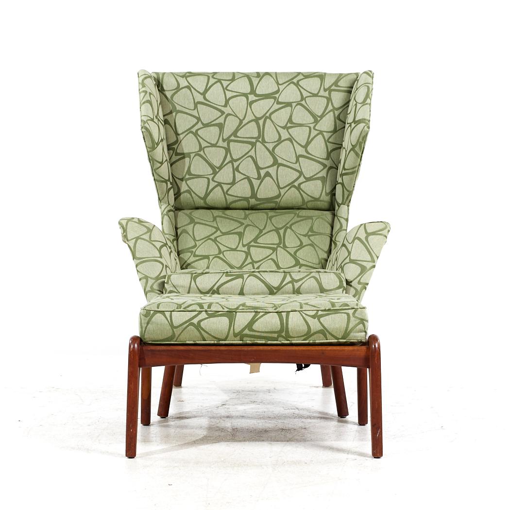 Adrian Pearsall for Craft Associates Mid Century Walnut Wingback Chair and Ottoman

The chair measures: 33.75 wide x 31 deep x 43 high, with a seat height of 18 inches and arm height/chair clearance of 24 inches
The ottoman measures: 25.25 wide x 22