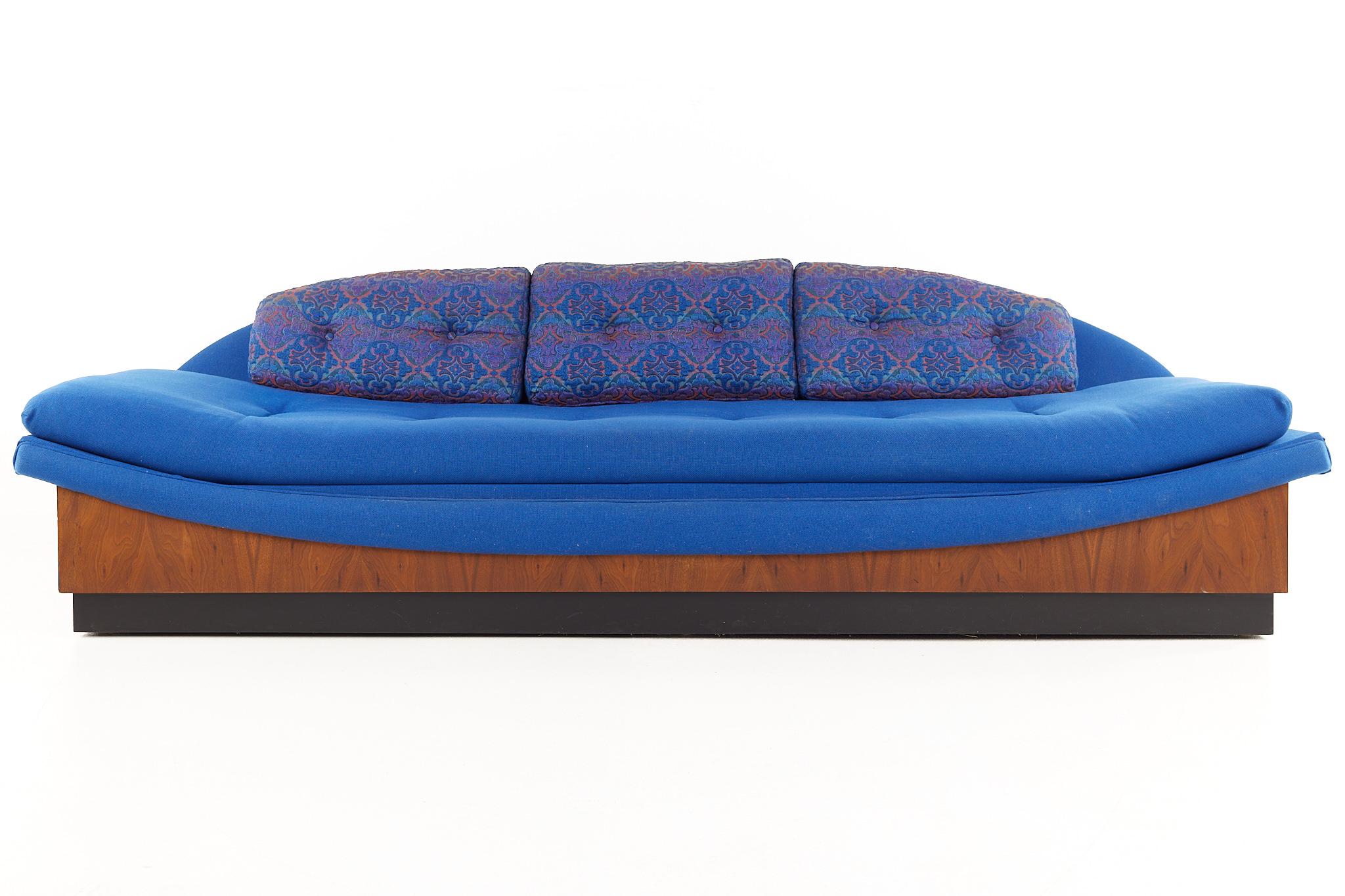 Adrian Pearsall for Craft Associates mid-century blue plinth base walnut gondola sofa

This sofa measures: 102.25 wide x 33 deep x 29 inches high, with a seat height of 19.25 inches

All pieces of furniture can be had in what we call restored