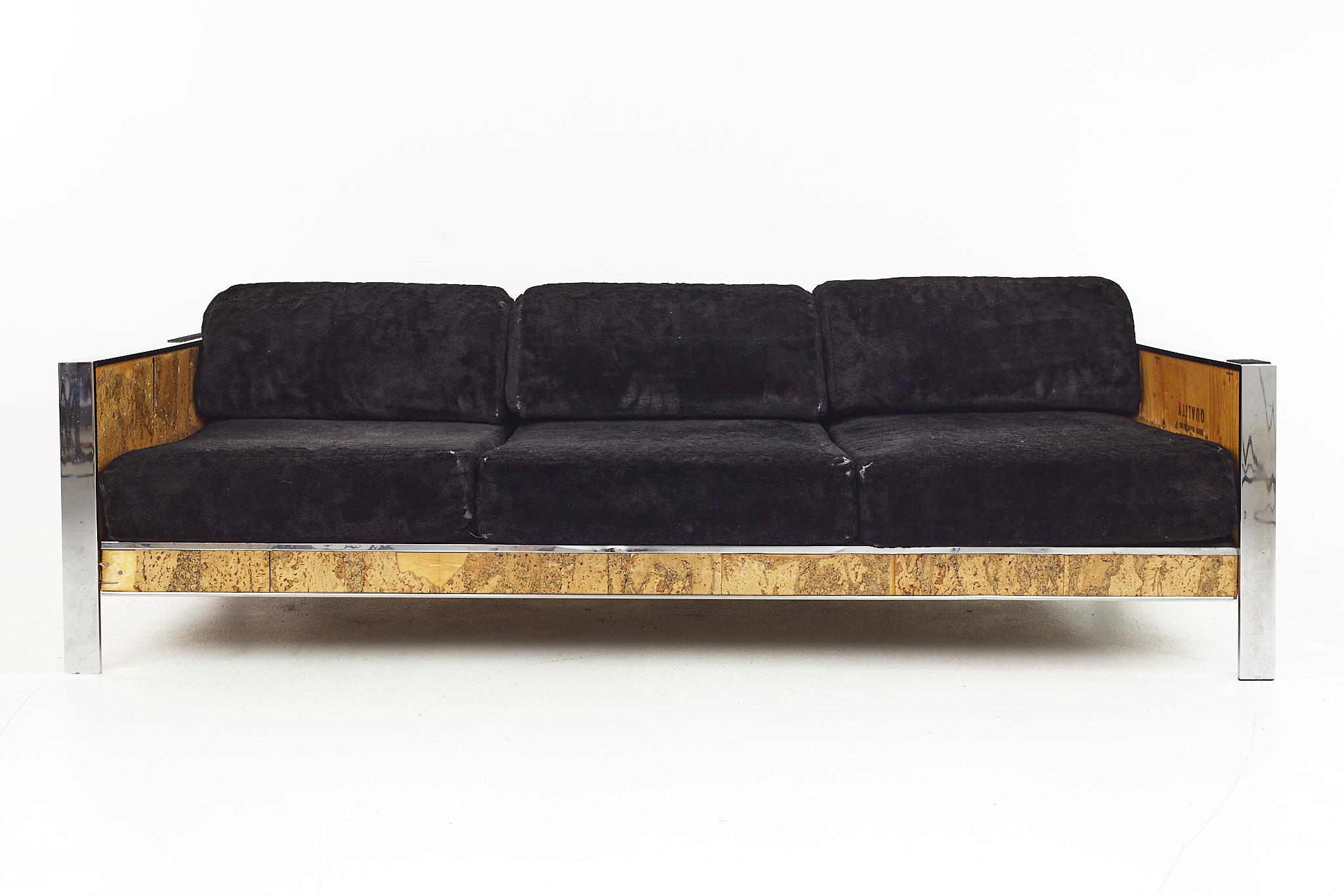 Adrian Pearsall for Craft Associates Mid Century Cork and Chrome Sofa

The sofa measures: 84.5 wide x 35.5 deep x 27.5 high, with a seat height of 16 inches and arm height of 22 inches 

Ready for new upholstery. This service is available for an