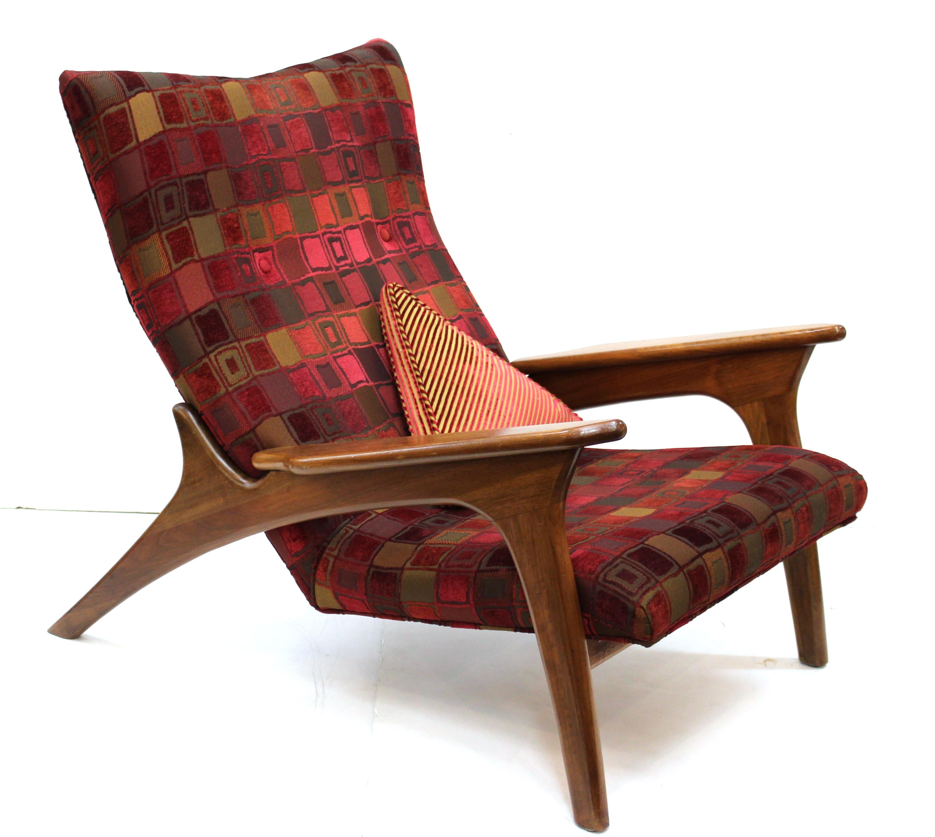 Adrian Pearsall for Craft Associates Mid-Century Modern lounge chair with ottoman, model 990-LC, made with a walnut frame. Comes with a small triangular designer cushion. The set is in great vintage condition, with age-appropriate wear to the wood.