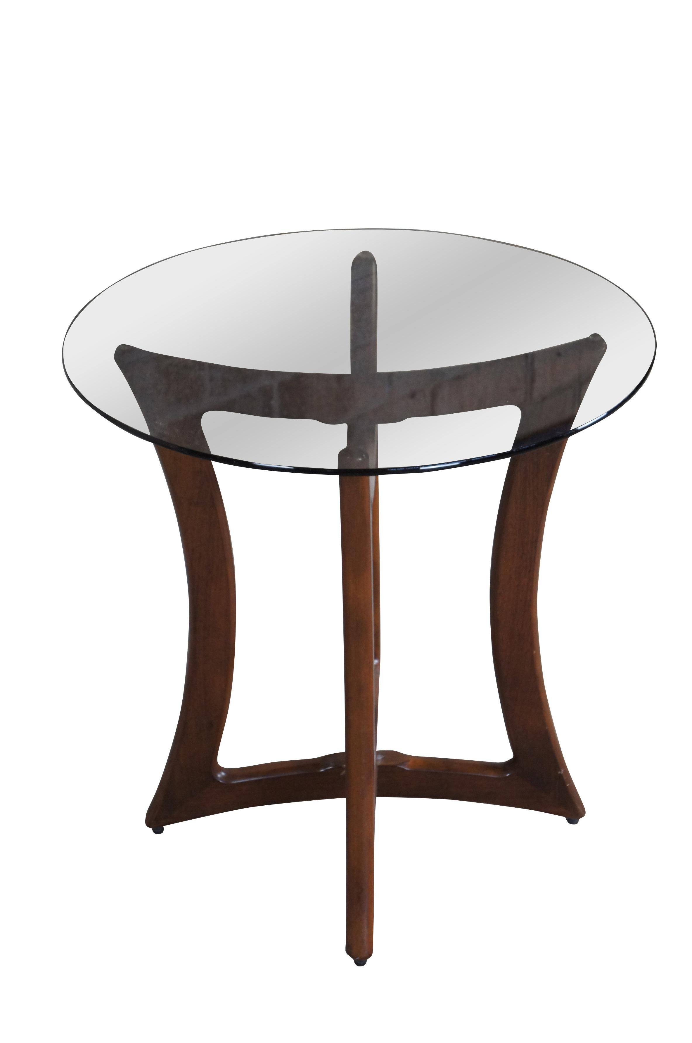 Sculptural organic modern side table by Adrian Pearsall for Craft Associates.  Features a sculptural dogbone walnut frame and smoked round glass top.  

Dimensions:
24