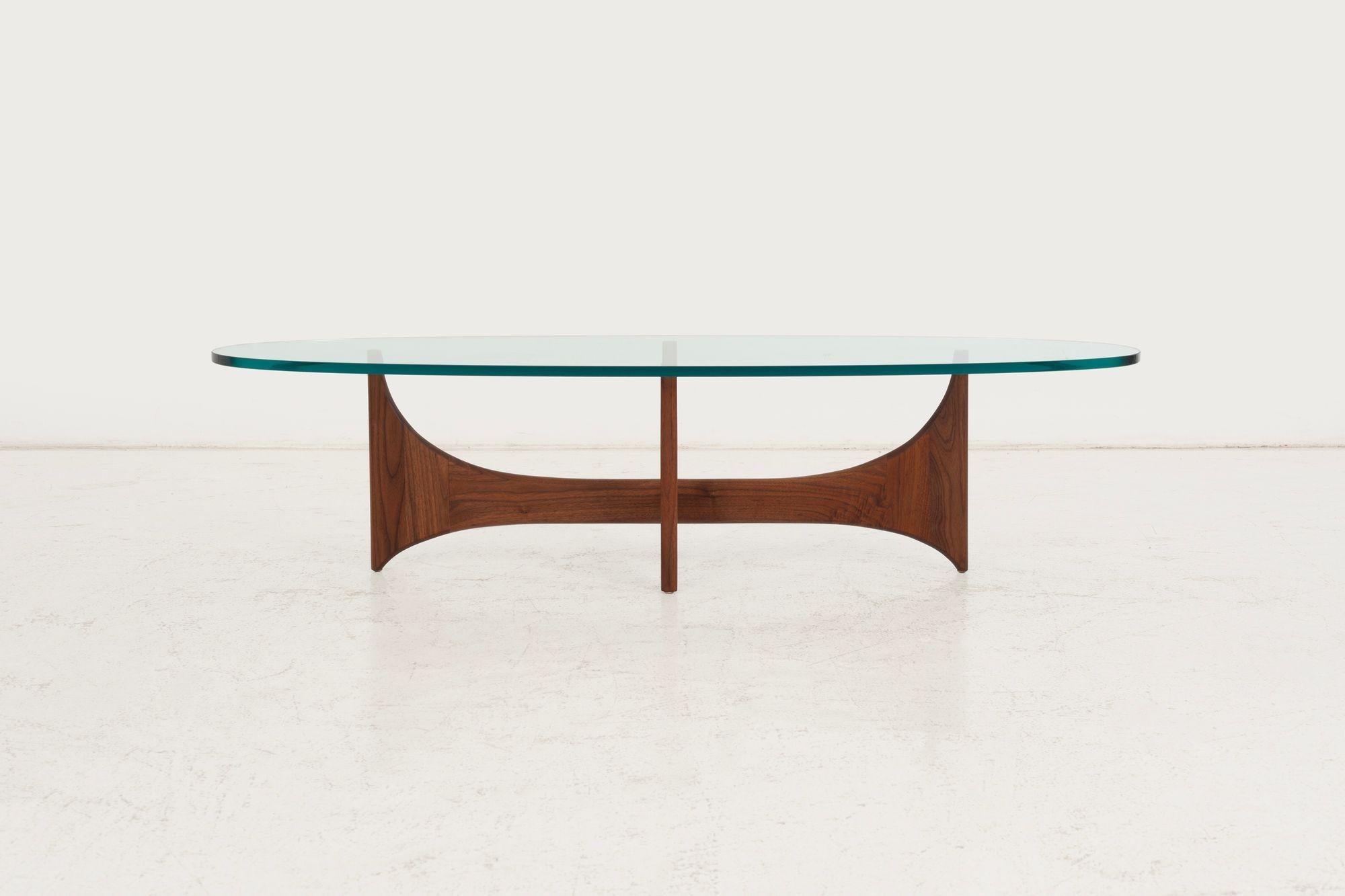 Adrian Pearsall for Craft Associates Oiled Walnut Coffee Table, 1965
A sculptural walnut coffee table designed by Adrian Pearsall for Craft Associates, circa 1965. The elongated base, crafted in solid oiled walnut, supports a thick, shaped glass