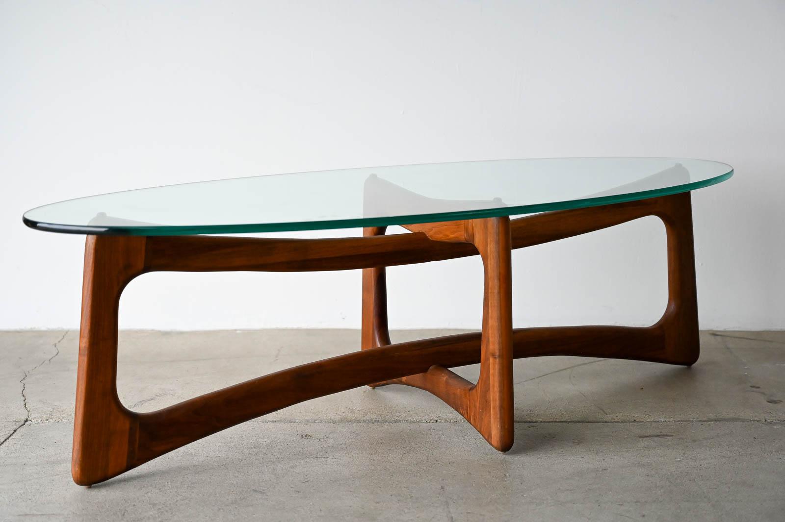 Adrian Pearsall for Craft Associates Oval Bowtie Walnut Coffee Table, ca. 1960.  Beautiful original glass and walnut frame in very good to excellent original condition.  Glass is thick green colored and original with only very slight wear as shown