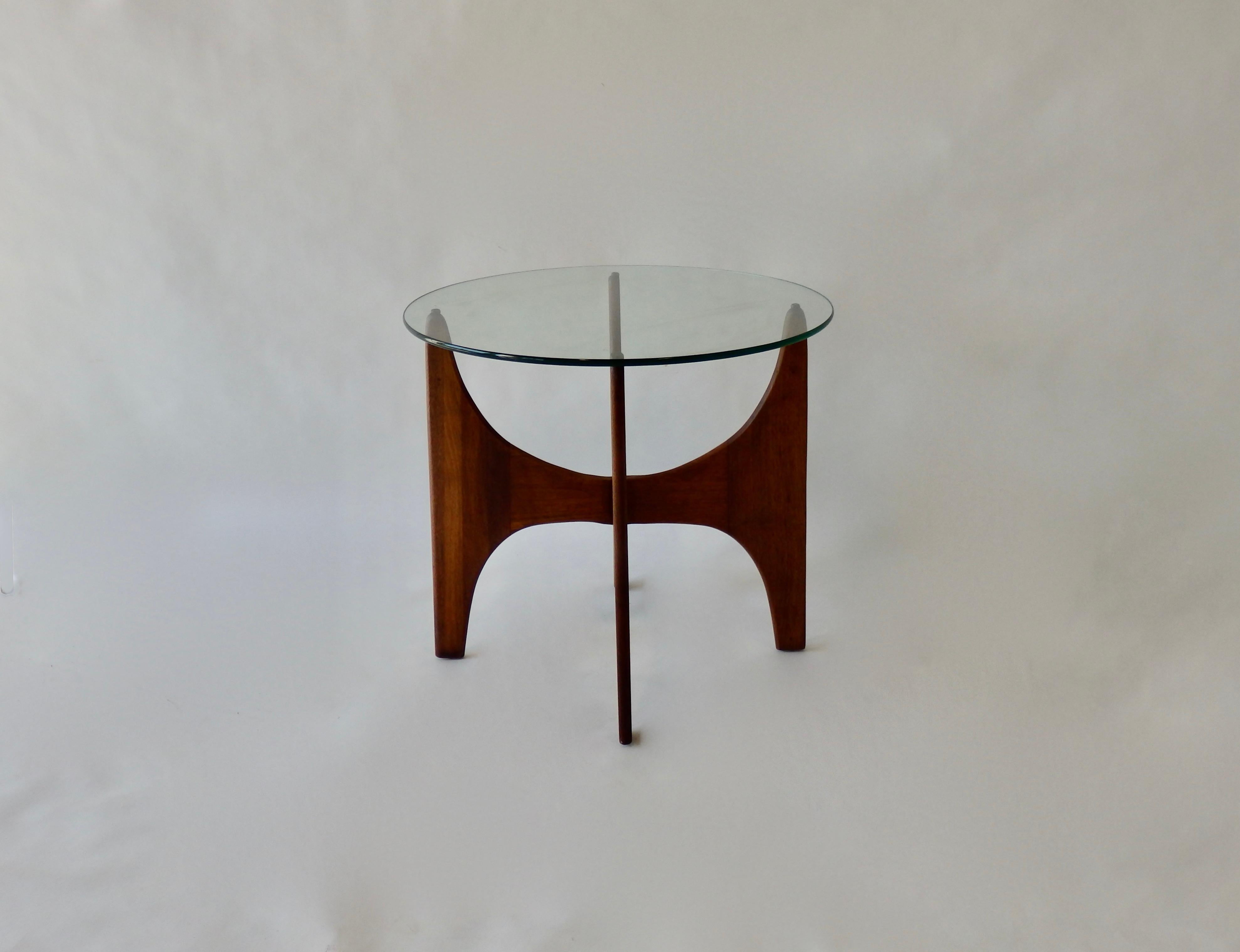 Architecturally styled walnut base holds round beveled glass top. Adrian Pearsall design for Craft Associates of Pennsylvania.