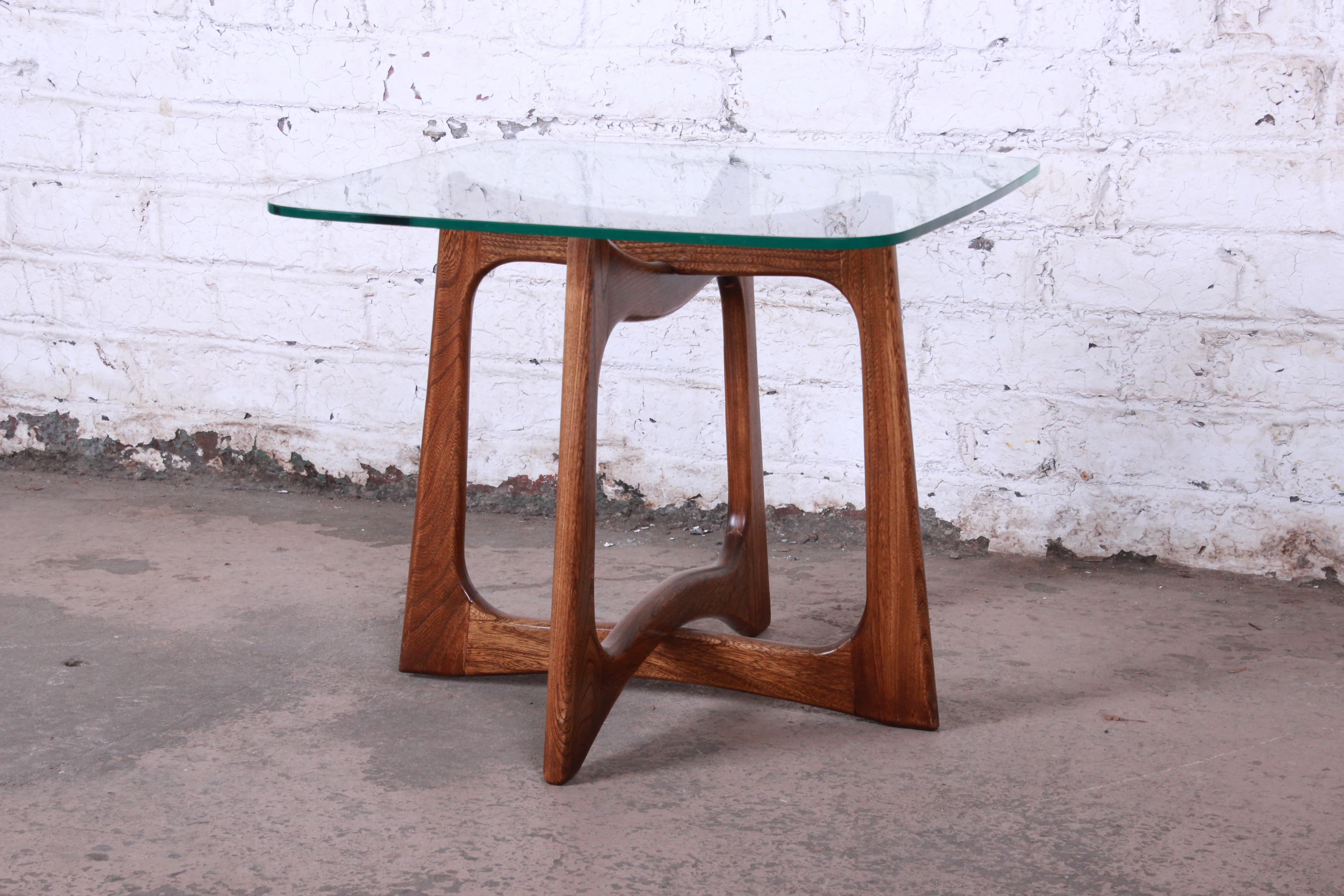 A gorgeous Mid-Century Modern sculpted walnut coffee table designed by Adrian Pearsall for Craft Associates. The table features a nice solid sculpted walnut base with beautiful wood grain. An excellent example of Pearsall's iconic design work. The