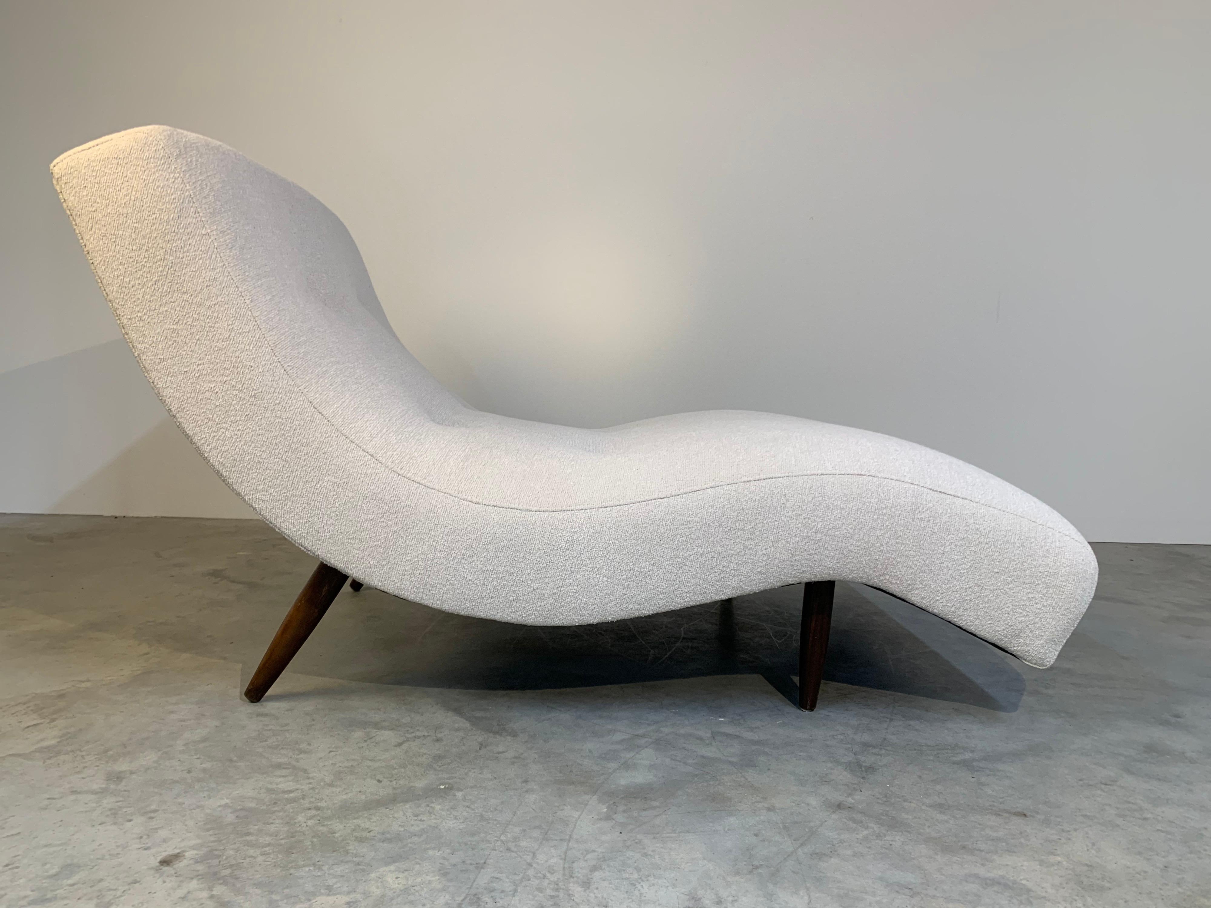 A stunning example of Adrian Pearsall’s “Wave” Chaise having walnut legs and fresh tufted Italian Boucle upholstery with new cushioning throughout. 
Extremely comfortable and solid. Excellent condition. Ready for use! 

Measures: 34 x 37 x 62
