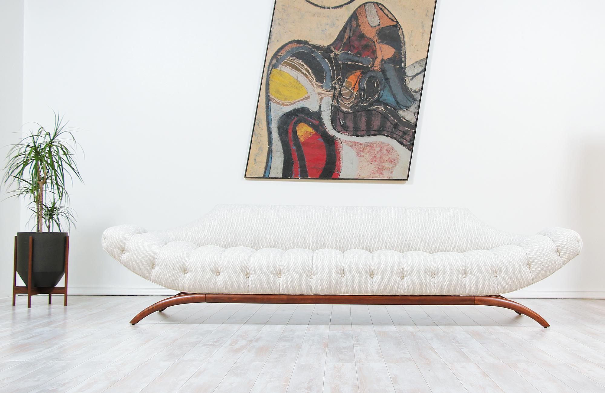 Extraordinary 'Gondola' sofa designed by Adrian Pearsall for craft associates in the United States, circa 1960s. A comfortable design crafted with a finely sculpted walnut wood base. The fluid lines and gondola shaped seat are both inviting and