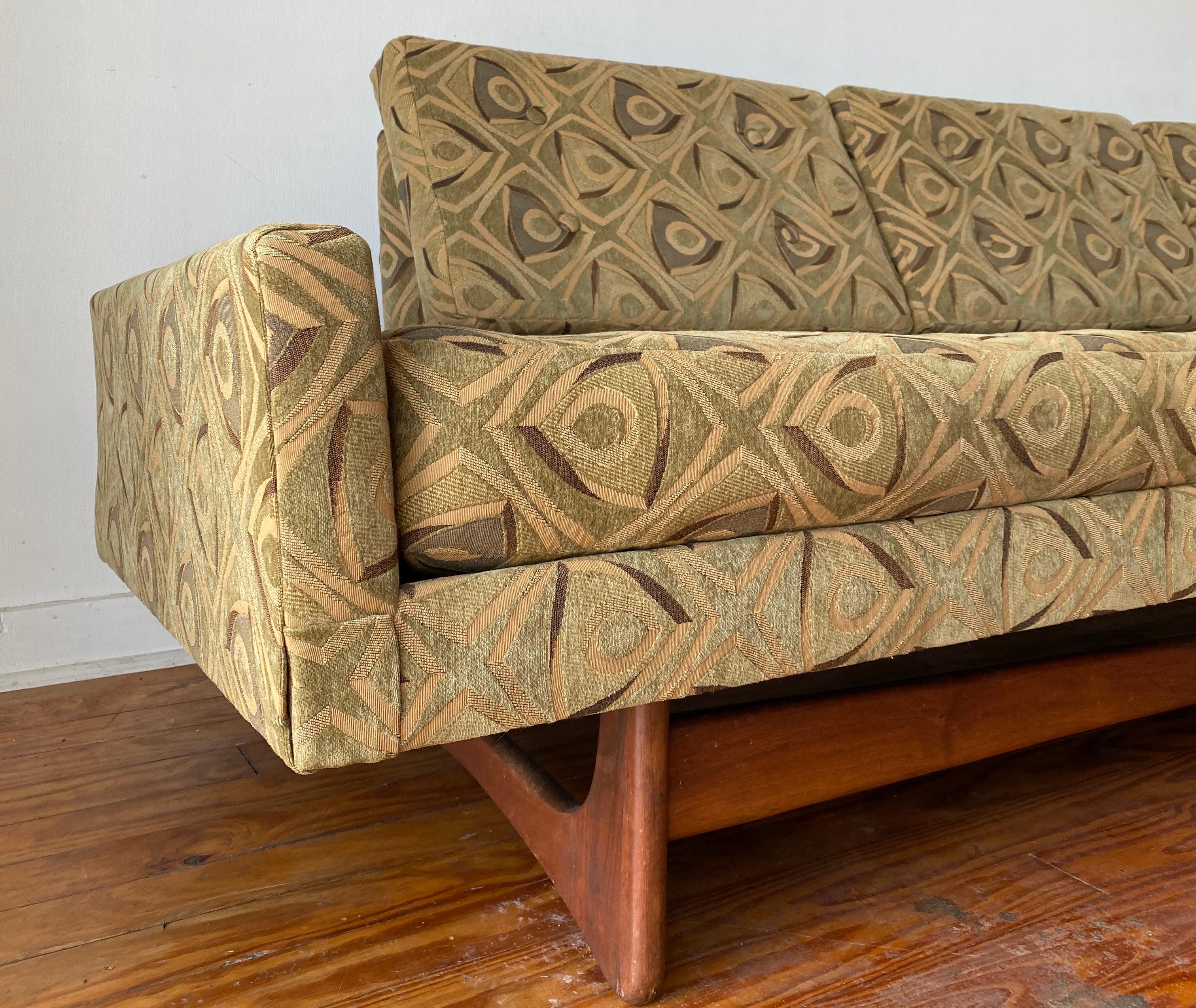 Model 2408-S, or the Gondola sofa, for Craft Associates. 

Original mid-century printed green velvet wool. Walnut base. One main settee cushion with three back rest cushions and two accent pillows. 

Condition: Great, some wear on walnut support