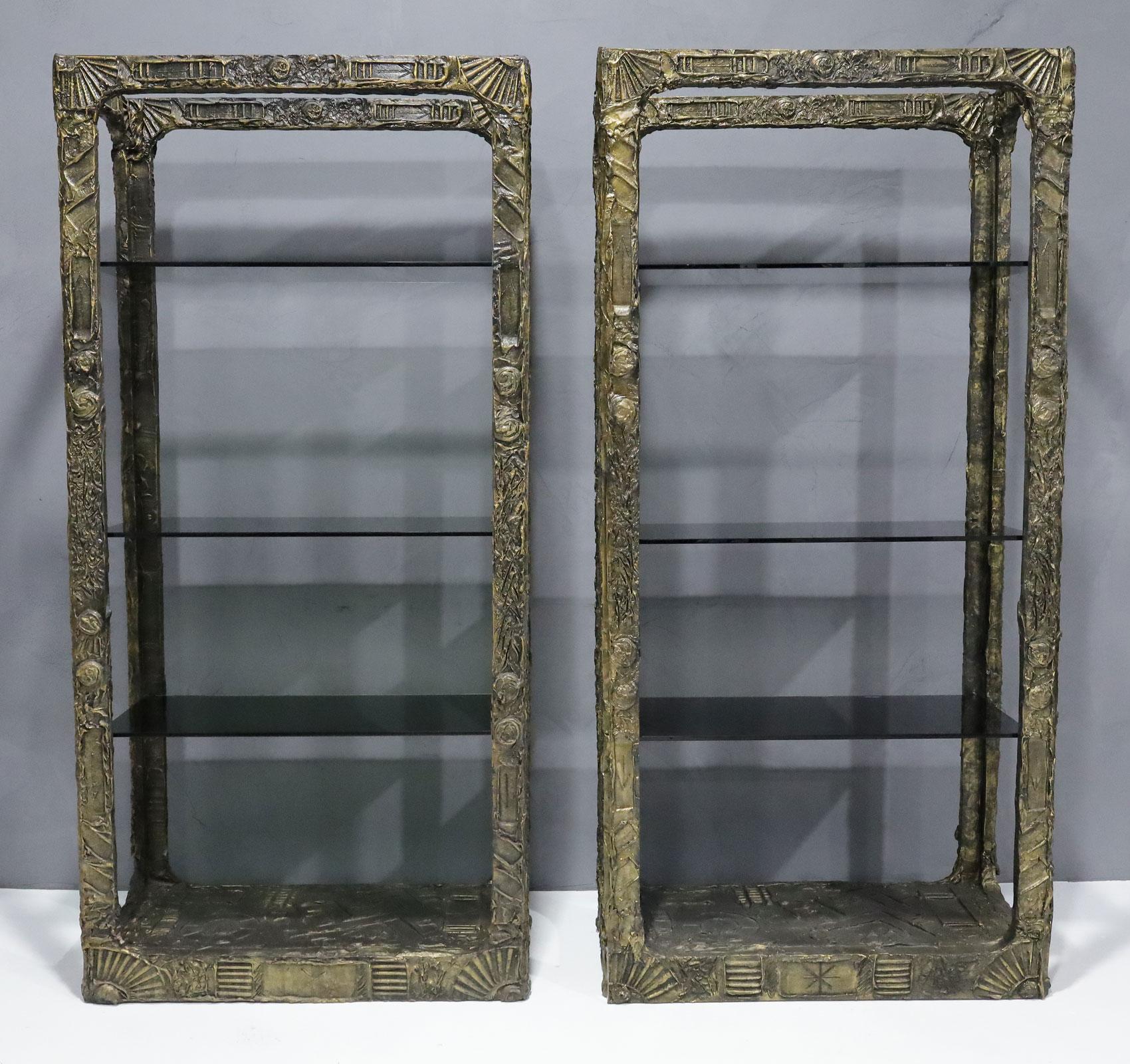 A stunning pair of Adrian Pearsall brutalist style etageres. These are in great condition. Each etagere has 3 smoked glass shelves. Theya re strong and sturdy and would look great as a room divider or banking a fireplace. 

We have touched up as