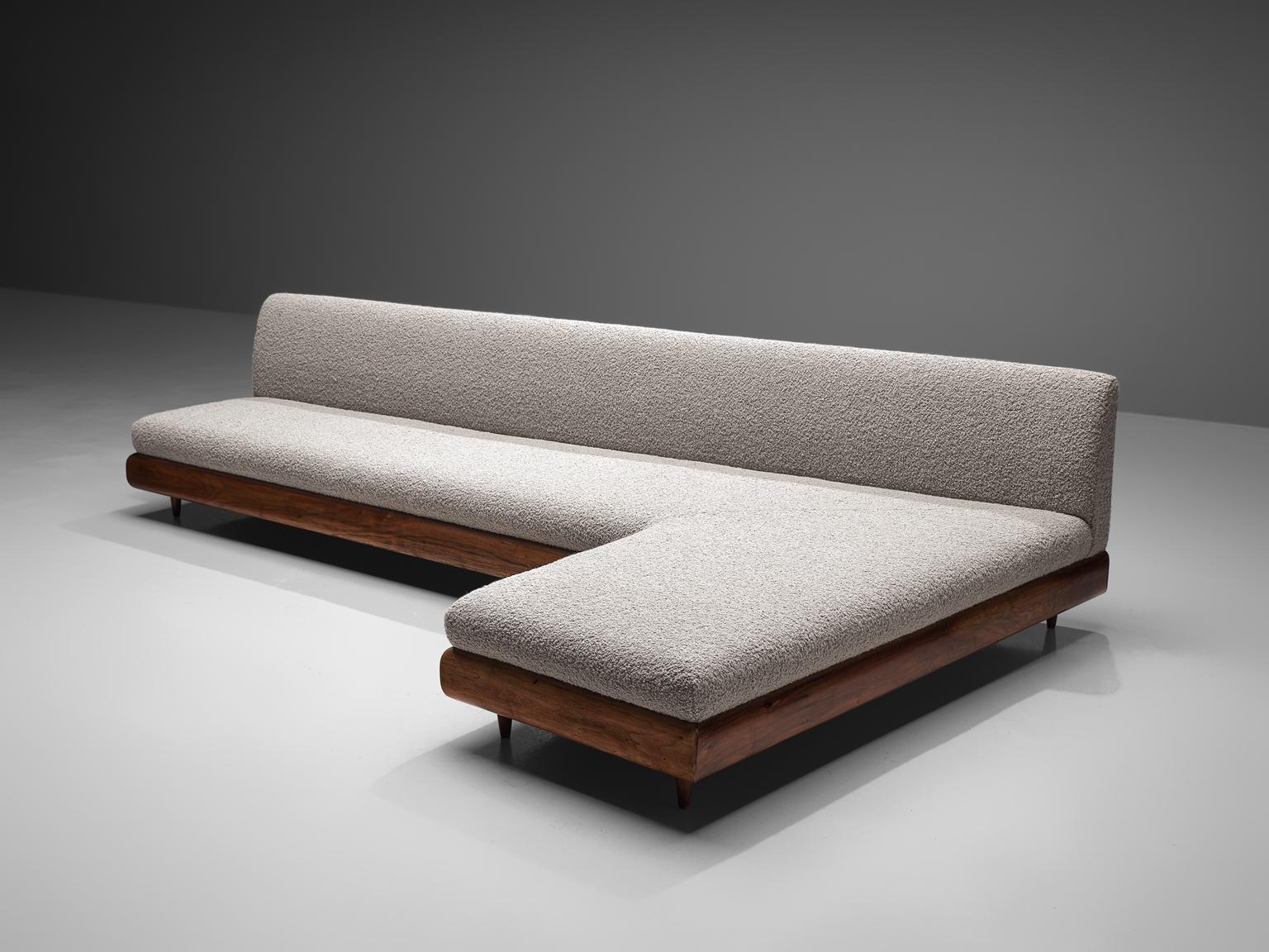 Adrian Pearsall, 'Boomerang' sofa, walnut, fabric, United States, 1960s

This 'boomerang' sofa has a unique shape with sinuous lines which create a monumental and inviting look. The right-facing sofa is a great addition to a living area or dining