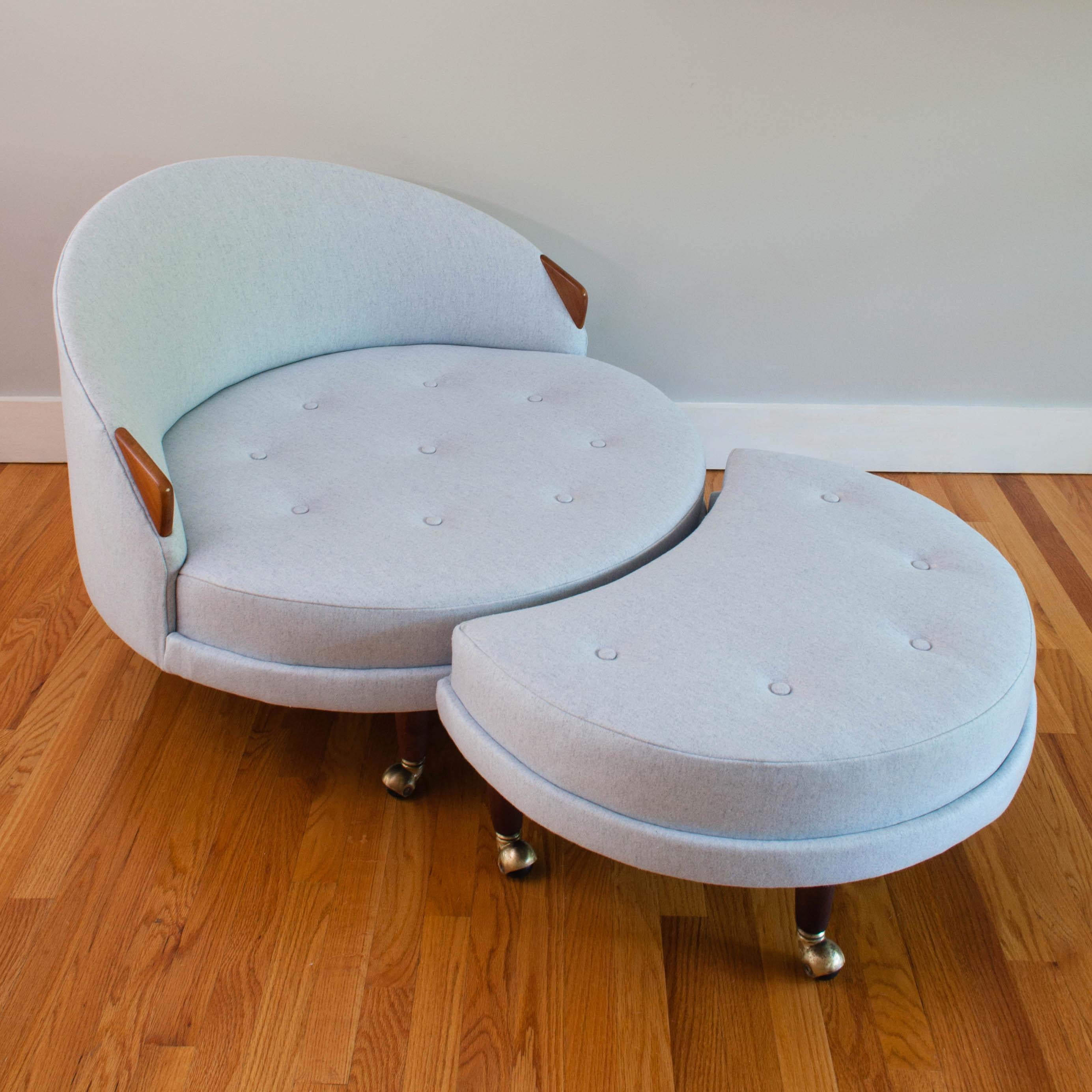 Iconic round “Havana” lounge chair by Adrian Pearsall for Craft Associates. This midcentury gem has been completely restored and features all new foam, light grey wool upholstery and refinished walnut arms and legs. The original brass casters have