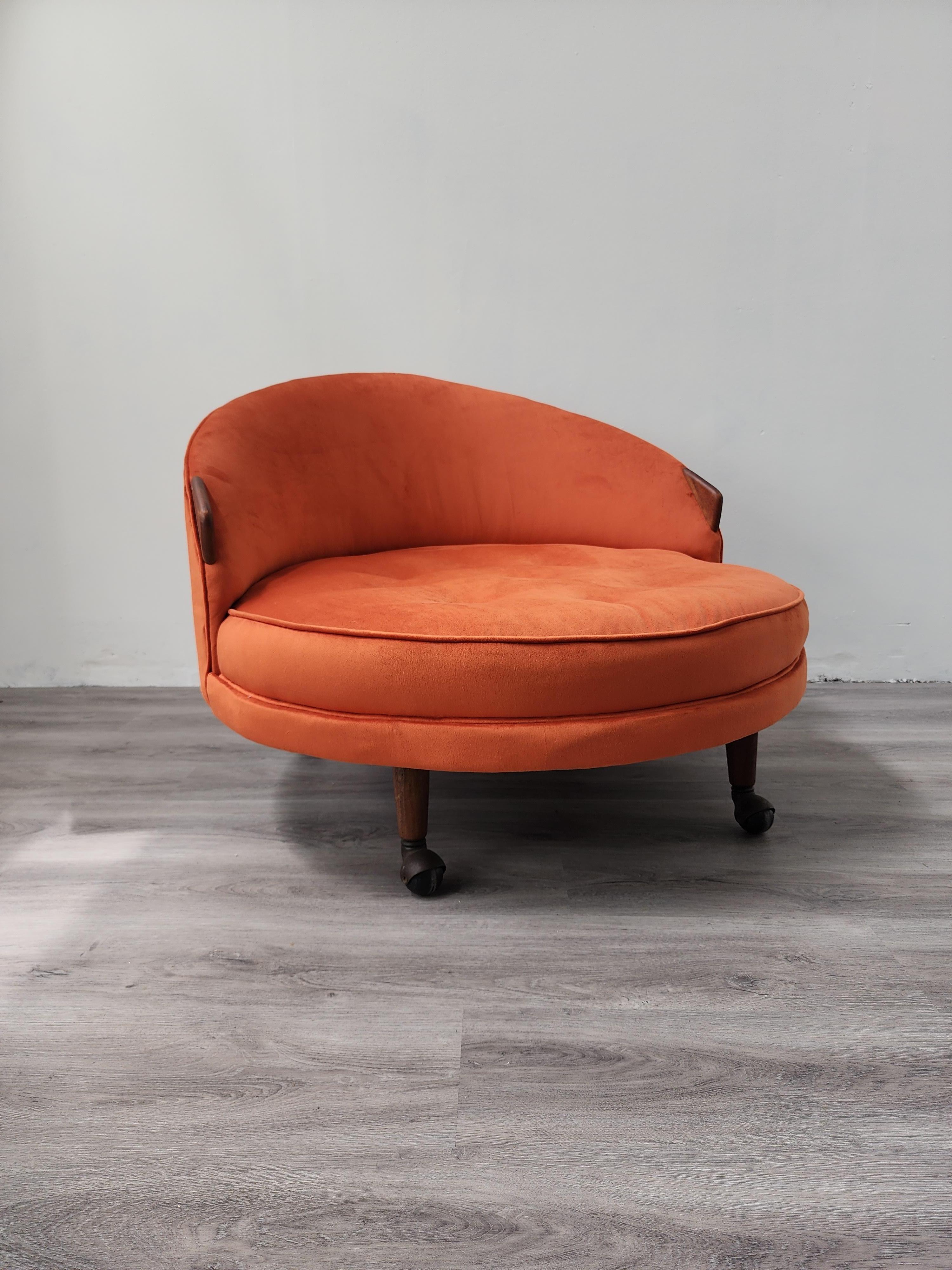 This chair is one of the most iconic designs of the mid-29th century. The Havana Chair designed by Adrian Pearsall is a statement piece with its vibrant color and large round base on wheels. The newly reupholstered chair is in the perfect orange