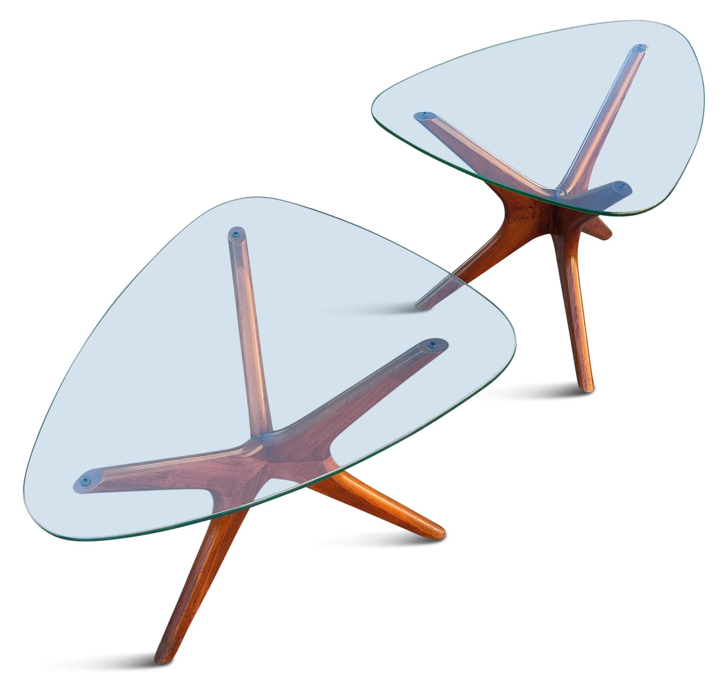 Designed by Adrain Pearsall and built by his company, Craft Associates, in the 1960s, these are classic Mid-Century Modern side or end tables. Often called the Jacks/Jax tables, due to the evocative sculpted walnut bases. The also resemble