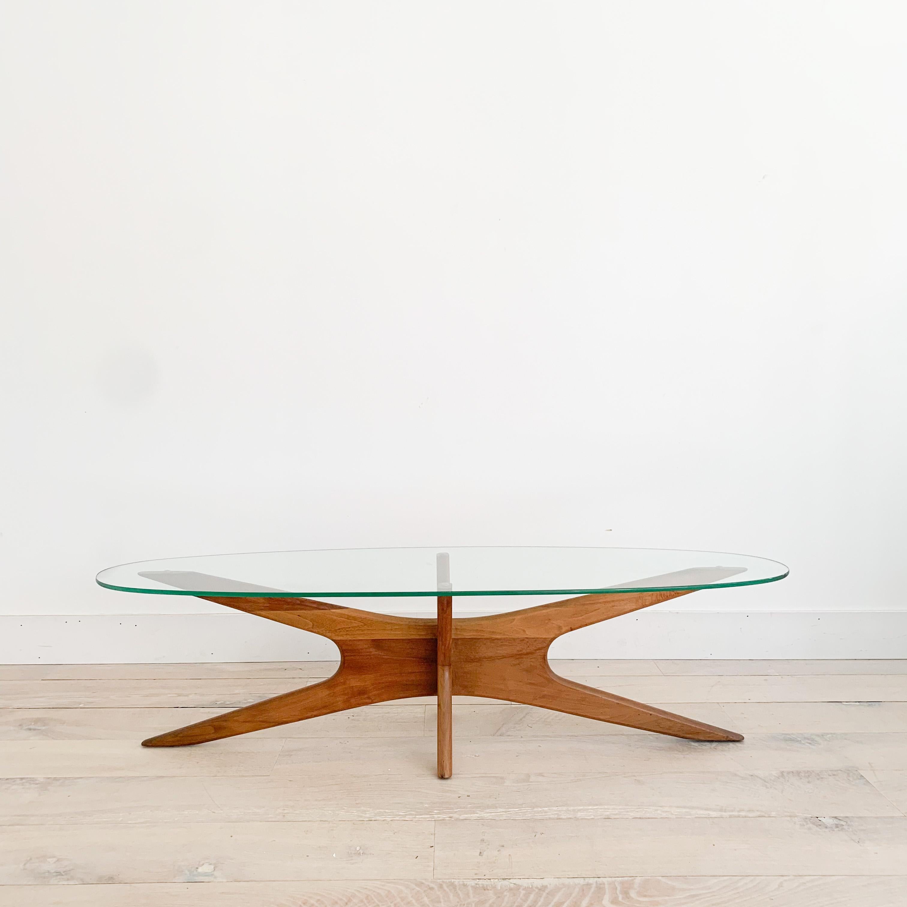 Mid century modern sculpted walnut coffee table with glass top design by Adrian Pearsall. Known as the Jacks table. Some scuffing/scratching to the glass top and the walnut frame (see up close photos).

59.25