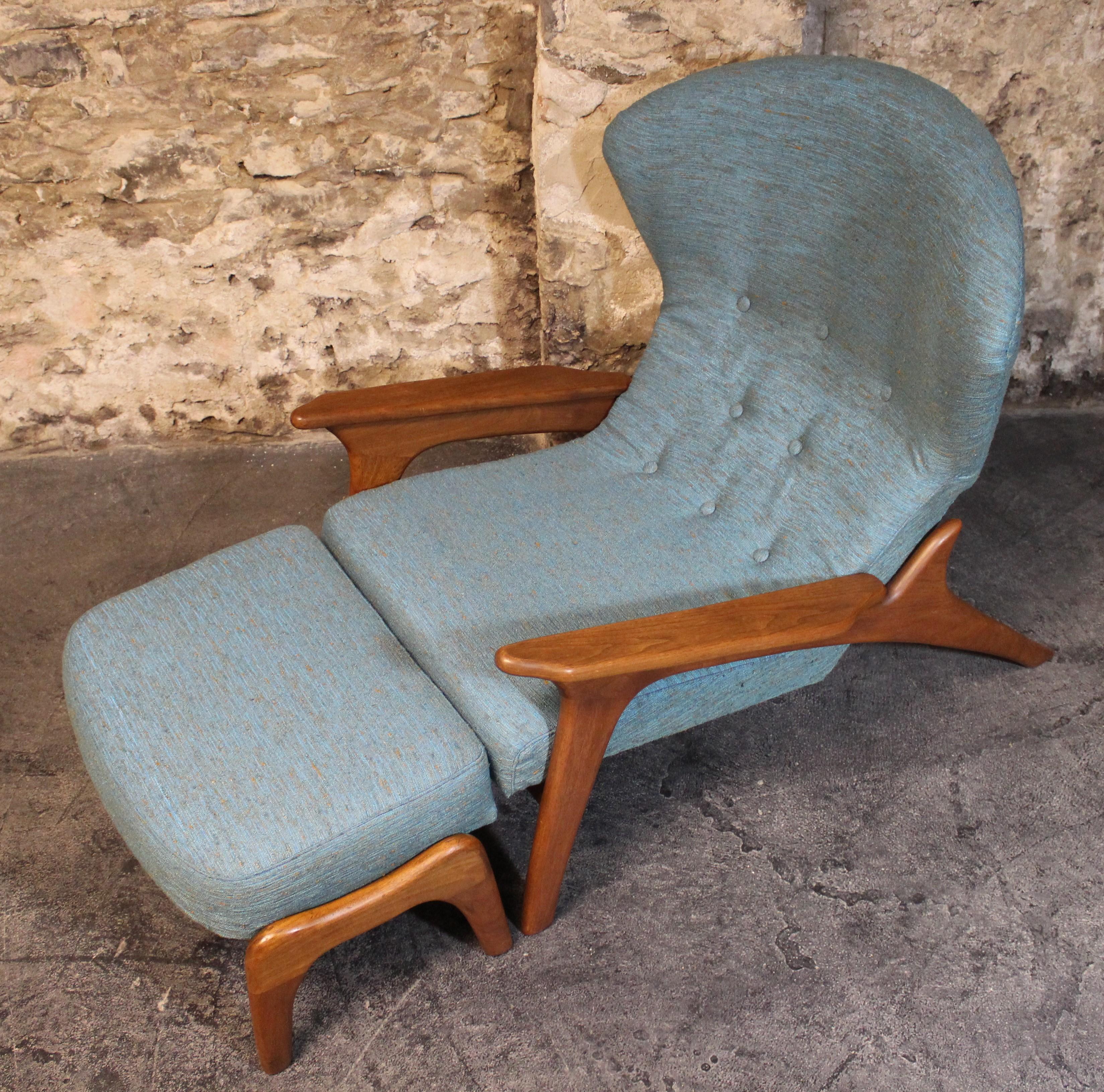 Adrian Pearsall lounge chair with a walnut frame that supports a modernist wing back re-upholstered seat.

Dimensions:
Chair 42