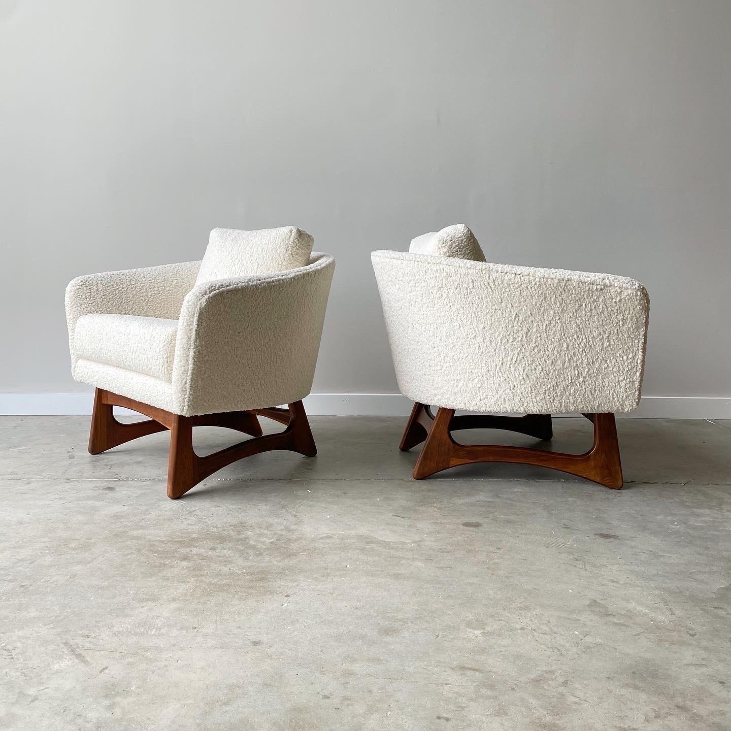 This pair from Adrian Pearsall feature his classic sculpted walnut base with barrel form seat.  
Newly refinished and upholstered in a chunky boucle.