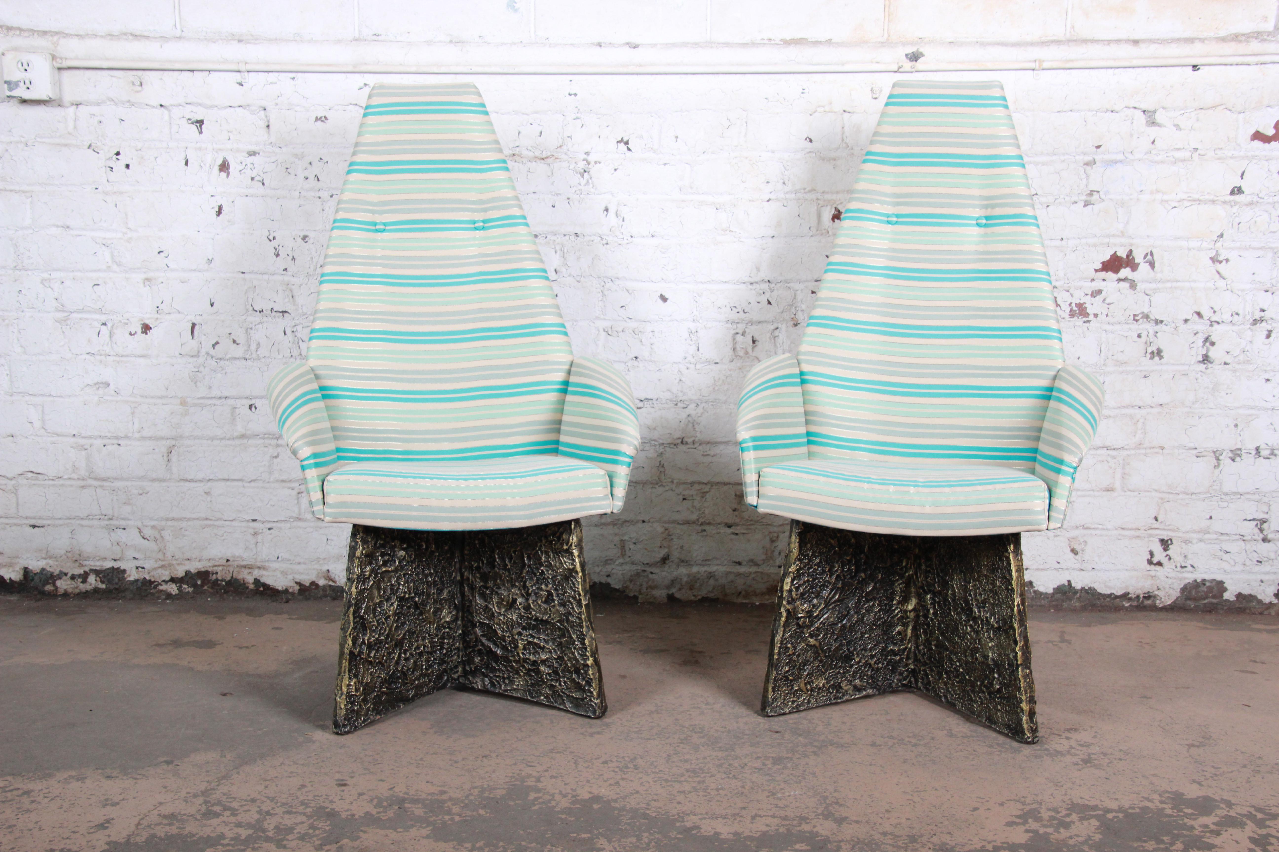 A rare and outstanding pair of Mid-Century Modern Brutalist lounge chairs designed by Adrian Pearsall. The chairs feature tall angular backs, with original striped upholstery and textured bronze resin bases. Iconic examples of the Brutalist design