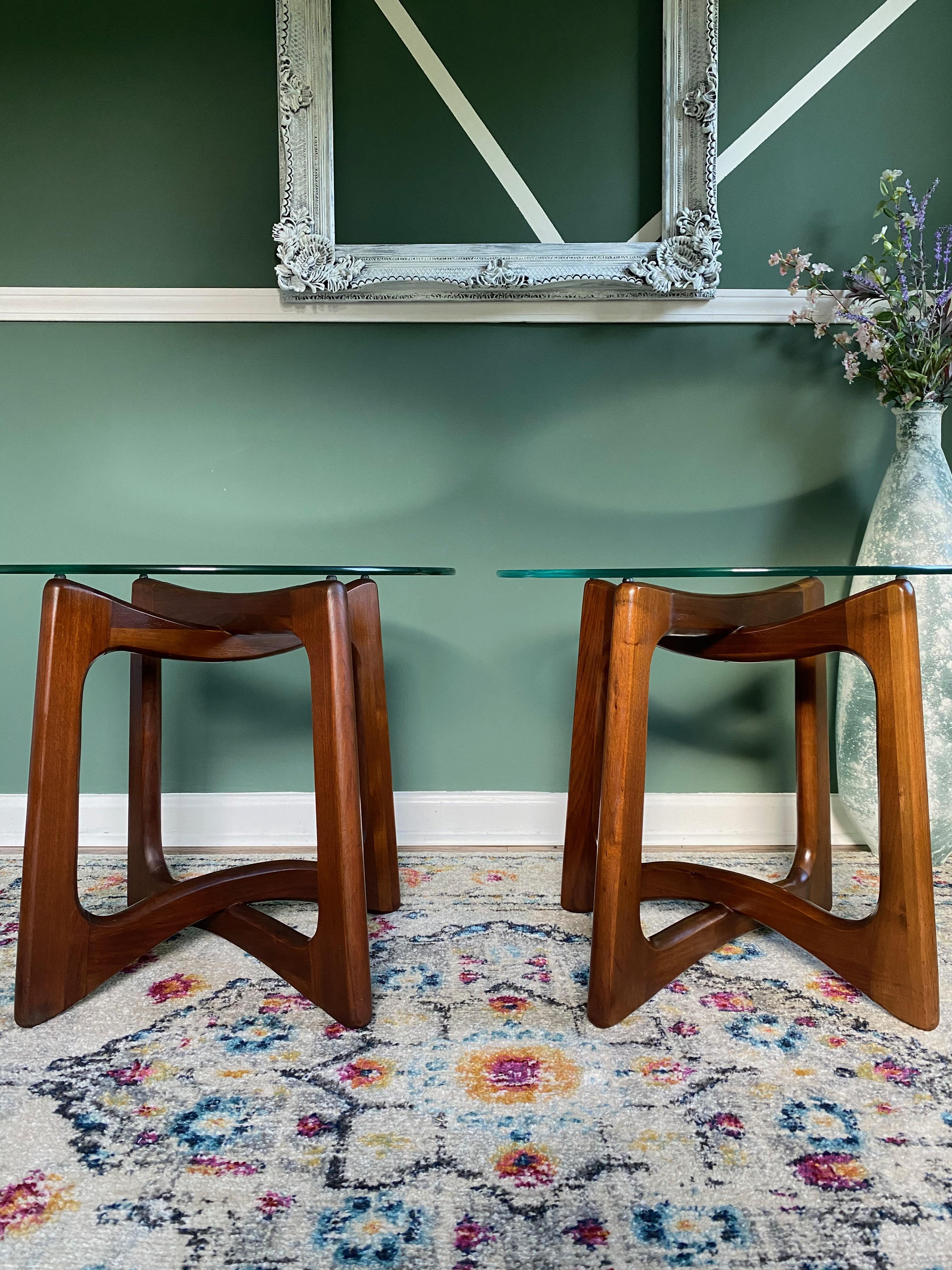 Beautiful pair of vintage 1960s modern tables designed by Adrian Pearsall for Craft Associates. Sculptural bases formed with interlocking open forms in solid walnut with round glass tops. Glass tops are removable. Marvelous pieces to have as end