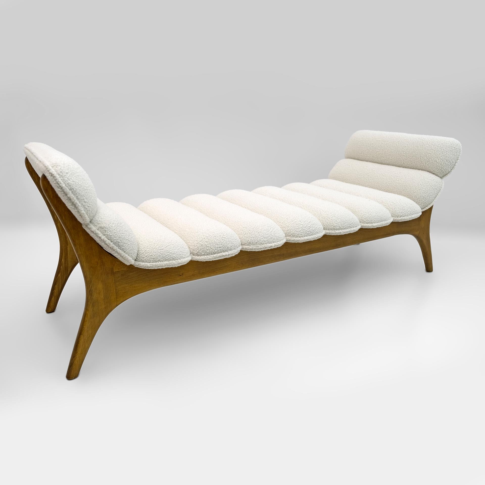 Chaise lounge designed by the American designer Adrian Pearsall. The structure of the cocktail lounge is made of walnut in a beautiful curved shape and covered in white chenille fabric. The chaise lounge has been restored and reupholstered.