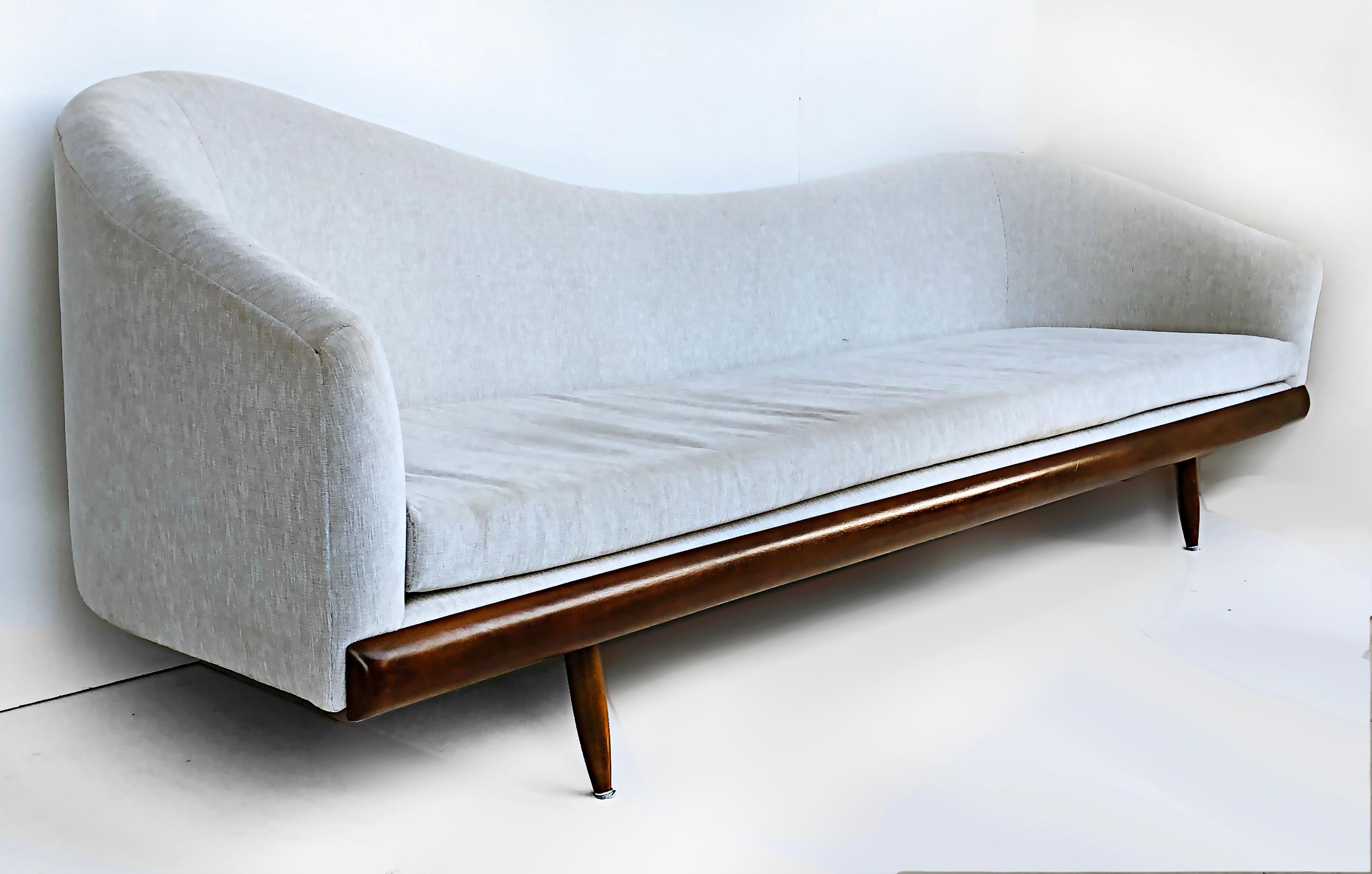 Adrian Pearsall Mid-century Upholstered Cloud sofa with walnut frame 

Offered for sale is a Mid-Century Modern cloud sofa by Adrian Pearsall. The sofa has great asymmetrical lines and is supported upon tapered feet. The upholstery is vintage but