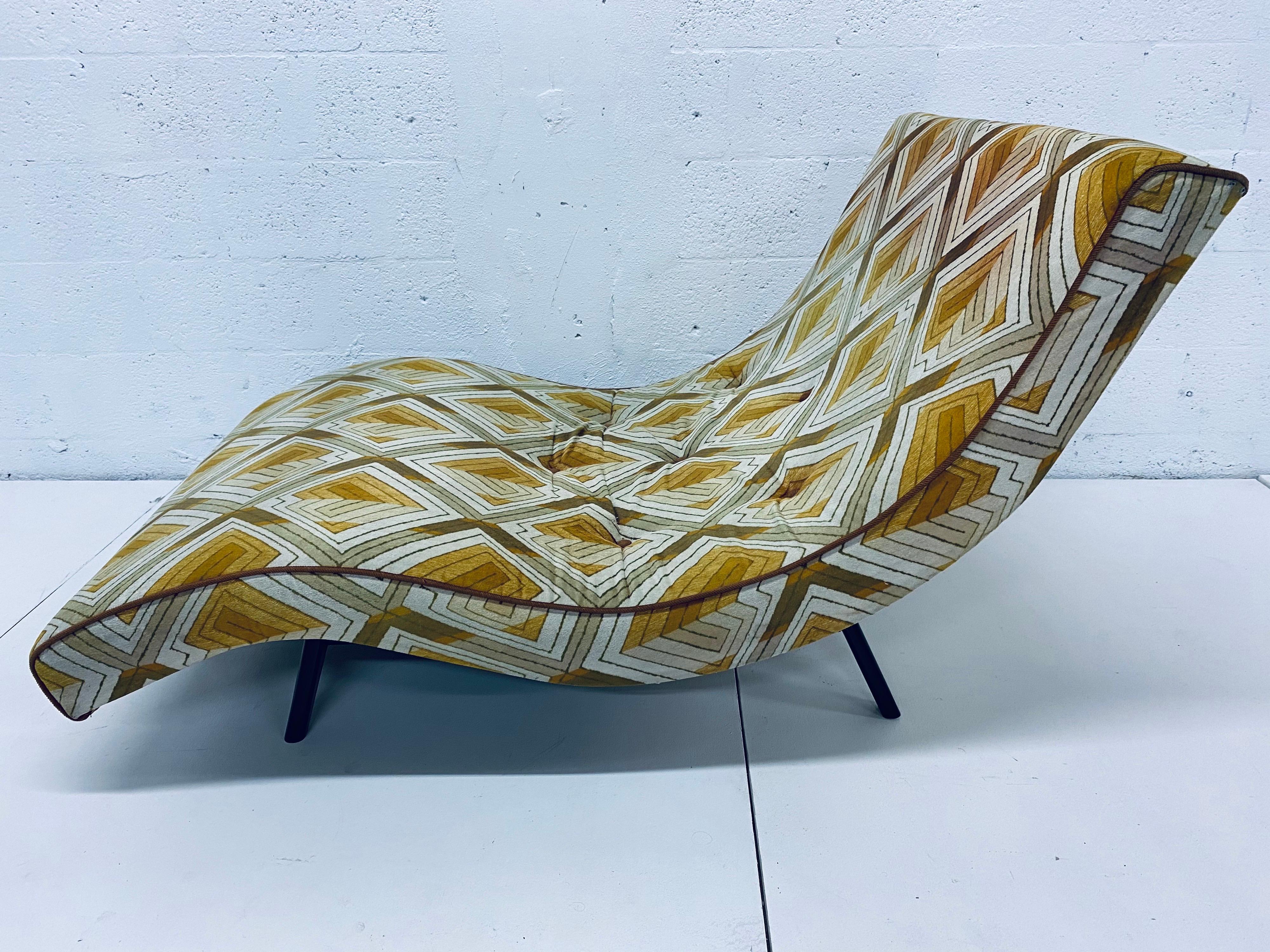 Mid-century 1970s waive chaise lounge with original geometric upholstery by Adrian Pearsall for Craft Associates. The frame has been refinished in an ebony stain. Use as is or have reupholstered.