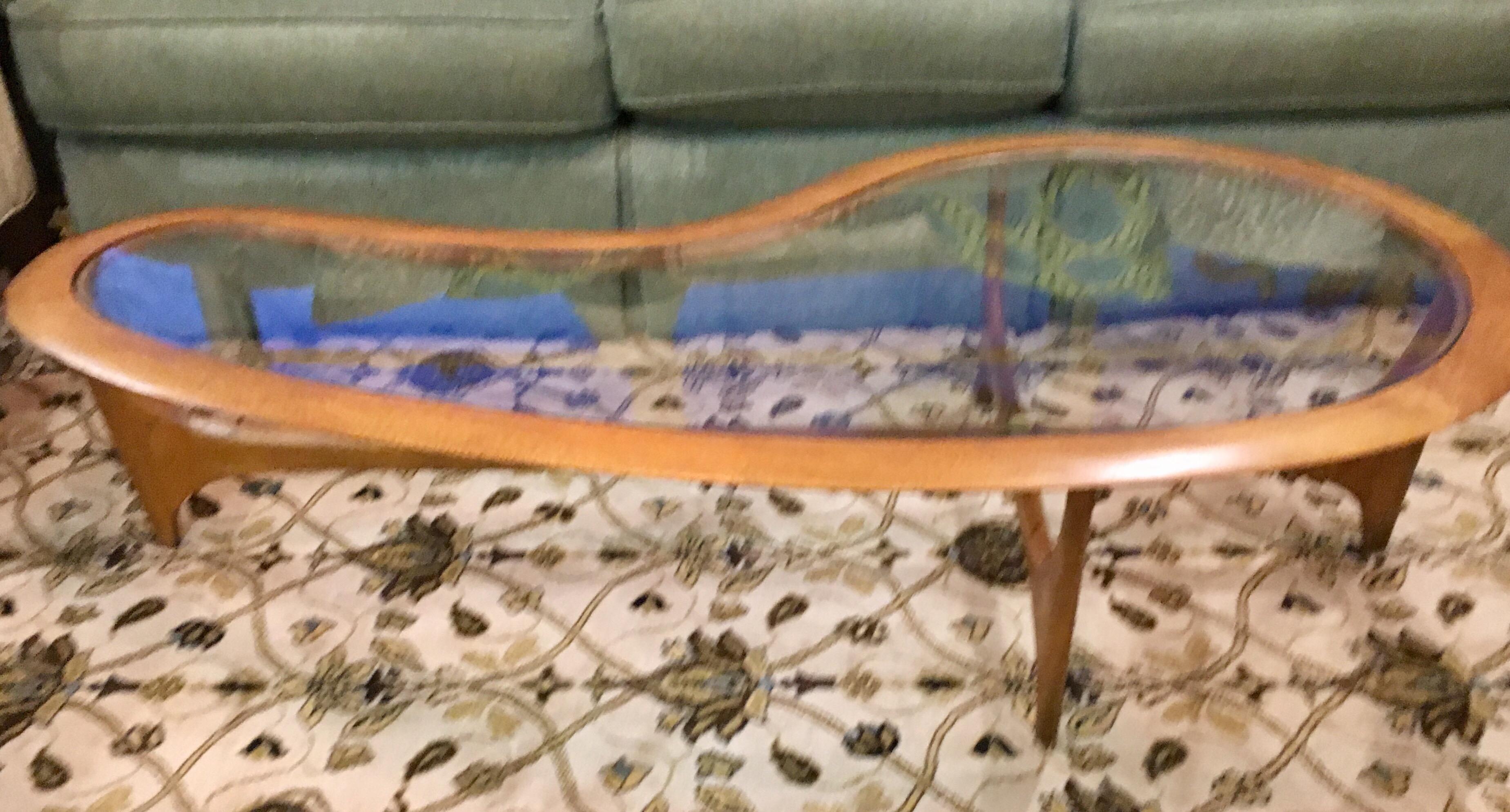 Stunning 1950s Pearsall extra large kidney shaped glass coffee table.  The numbers on the bottom read as
follows: Model 116354, PAT. NO. 203449, and 4079010DES.  It is very large, see dimensions below.
